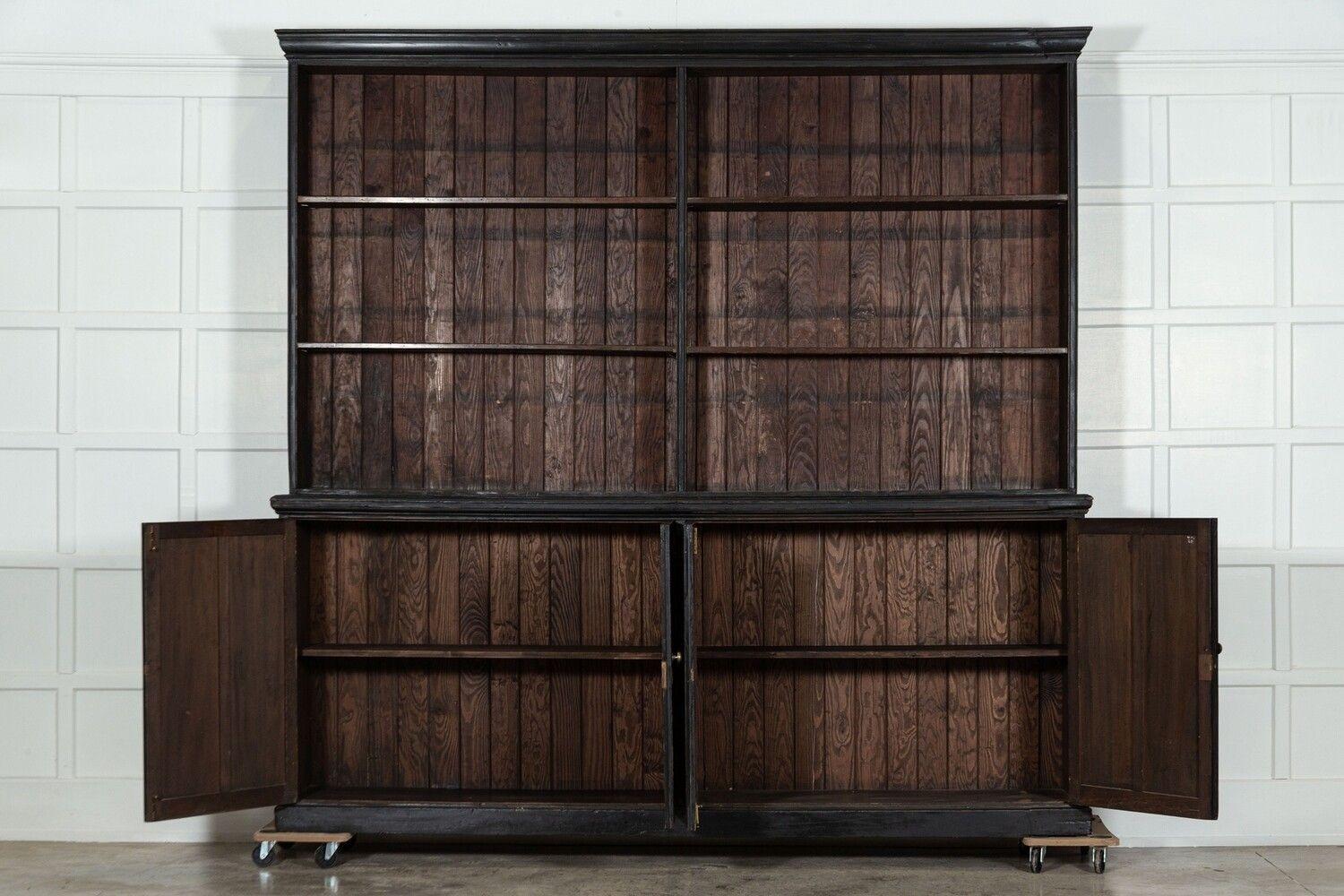 circa 1920
Monumental English Ebonised Beech Bookcase Cabinet
sku 1651
Base W260 x D47 x H108 cm
Top W263 x D30 x H149 cm
Together W263 x D47 x H257 cm
