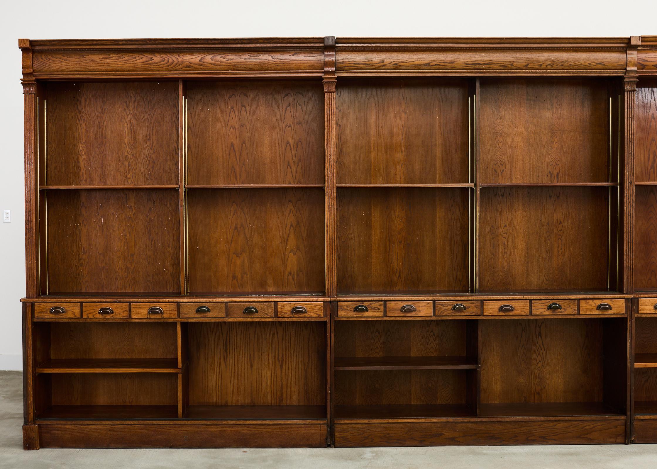 Monumental English Oak Haberdashery Display Bookcase Cabinet 18 ft. In Distressed Condition In Rio Vista, CA