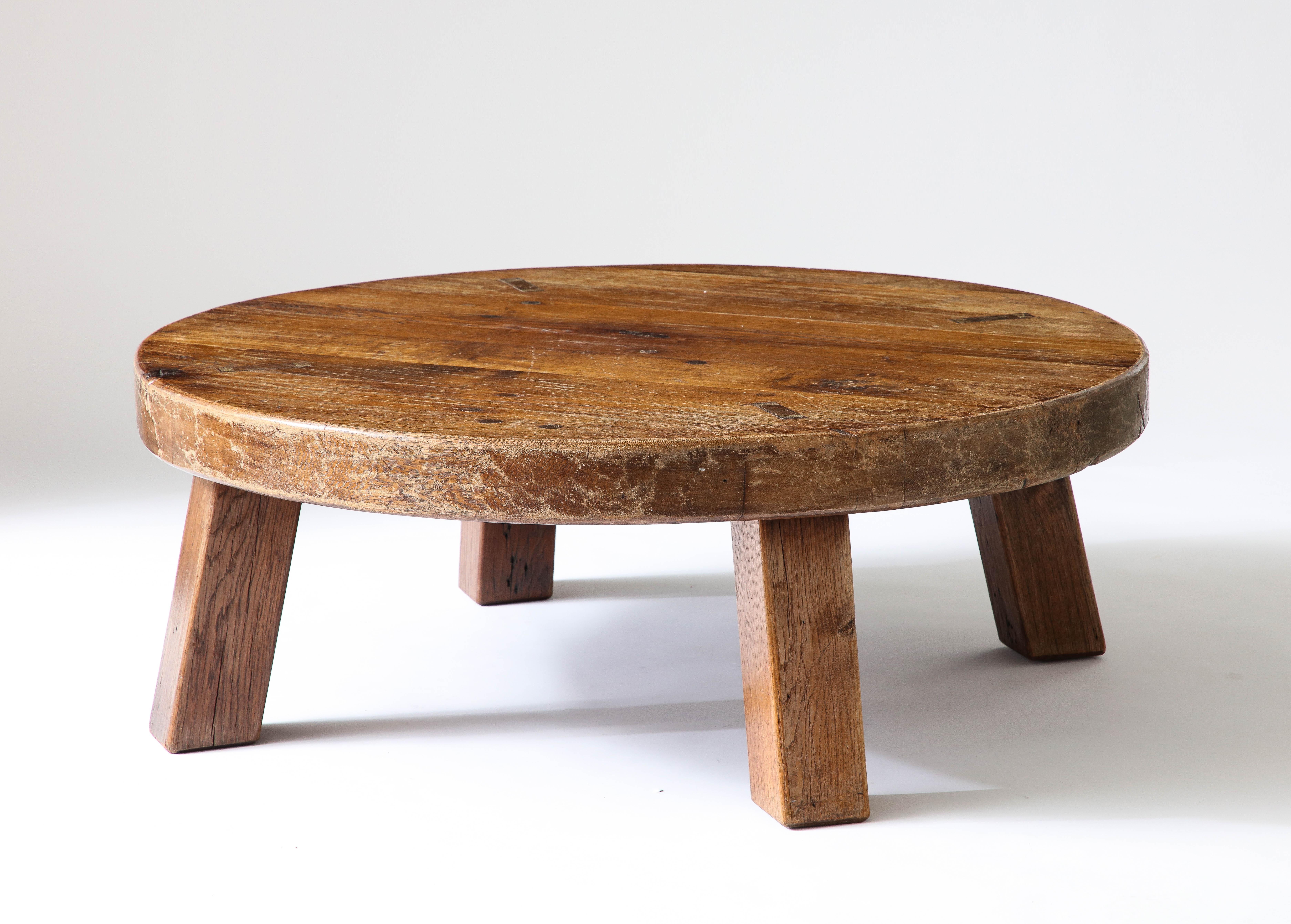 Monumental, rustic center table with exposed joinery.