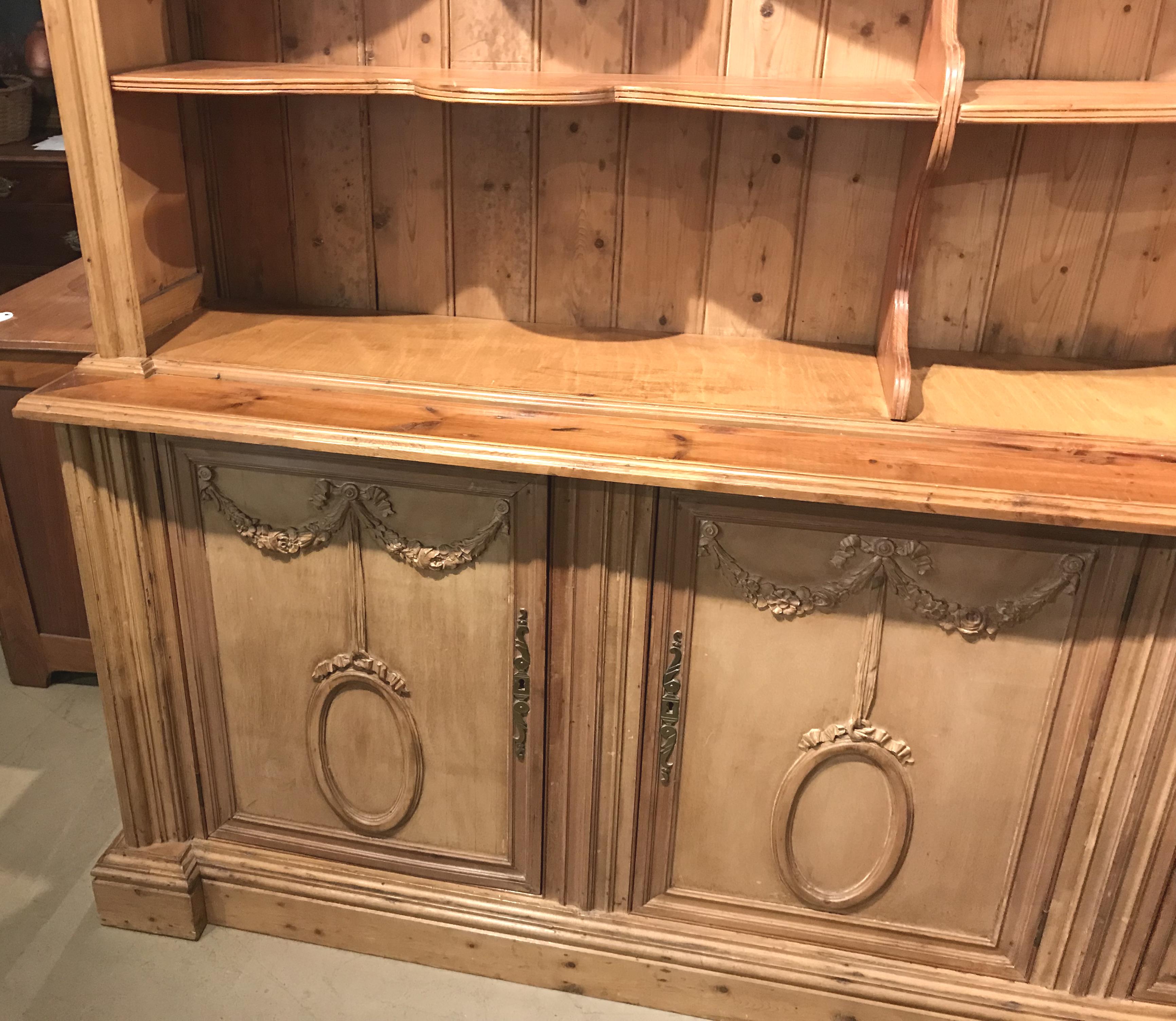 Monumental European Two Part Pine Bookcase / Hutch with Foliate Carved Crest In Good Condition In Milford, NH