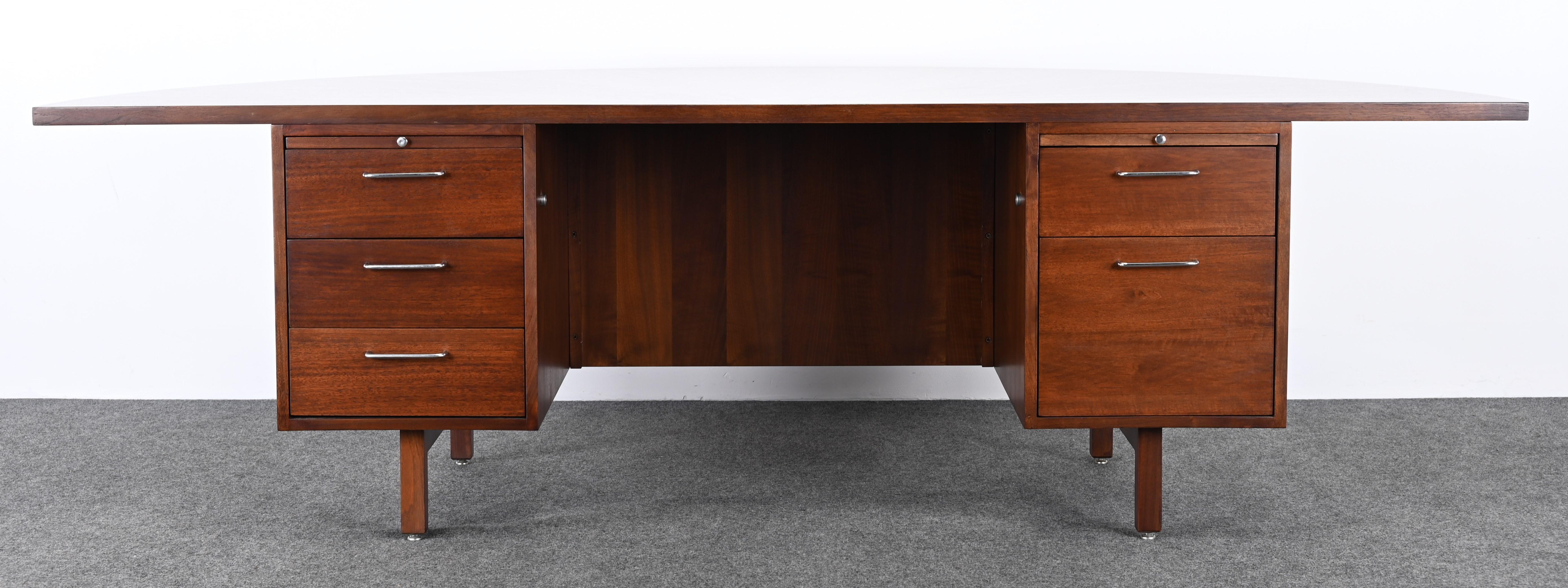 A rare walnut Demi Lune Executive desk by Jens Risom, 1950. This beautiful desk has been fully restored in a dark walnut finish. This desk would work well in any Mid-Century Modern home, as well as, Traditional or Contemporary. Structurally sound