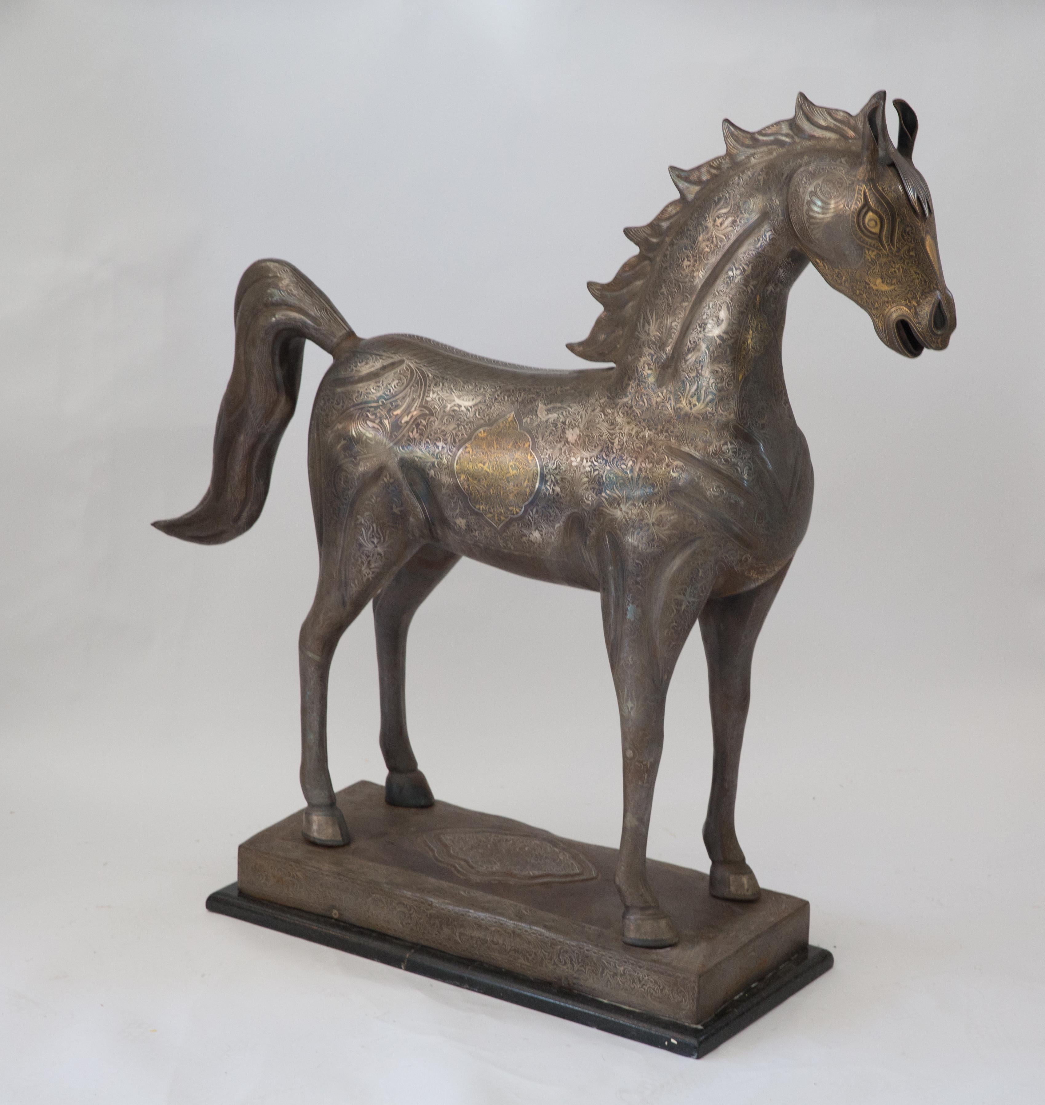 This exceptional unique horse sculpture stands over 3 feet tall and exhibits the artist’s ability to accomplish the most intricate and fine damascene inlay work. The horse’s head, body, legs, feet, mane and tail are all richly inlaid with real gold