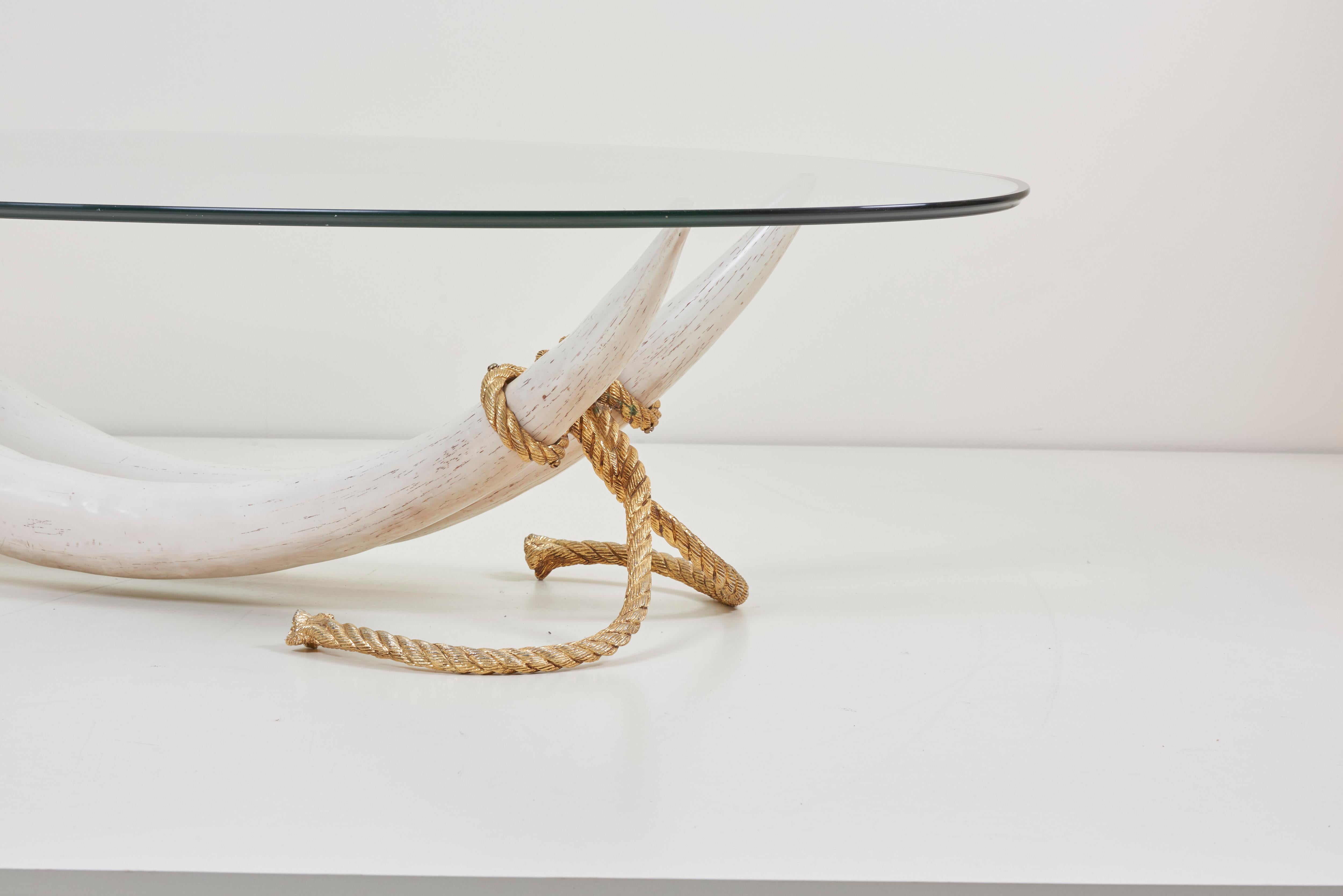 Wonderful and impressive faux elephant tusk coffee table in a monumental size.
The table is attributed to Maison Jasen und will be a real eye catcher in every room.