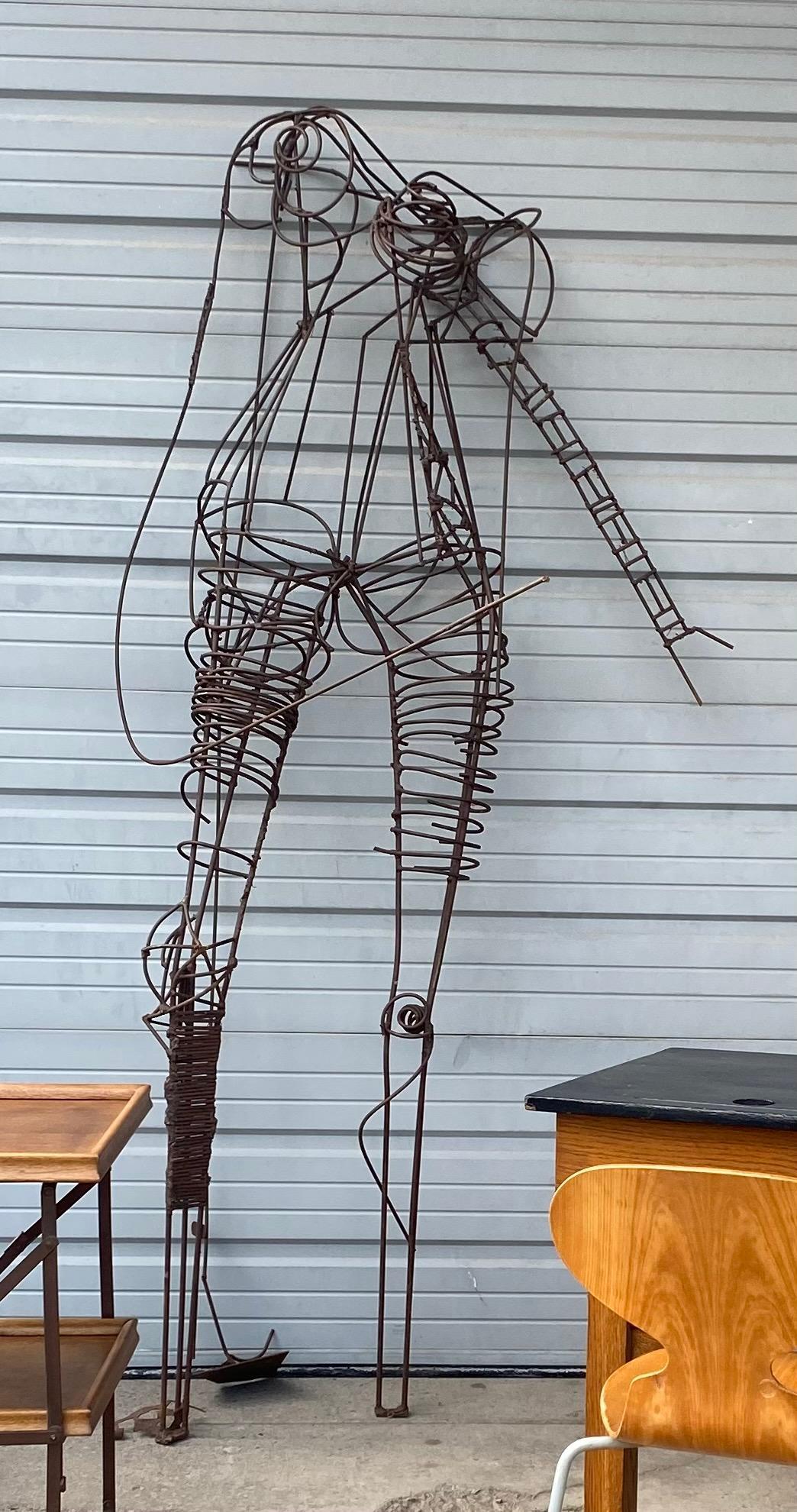 Monumental figurative wire iron sculpture, female figure titled 