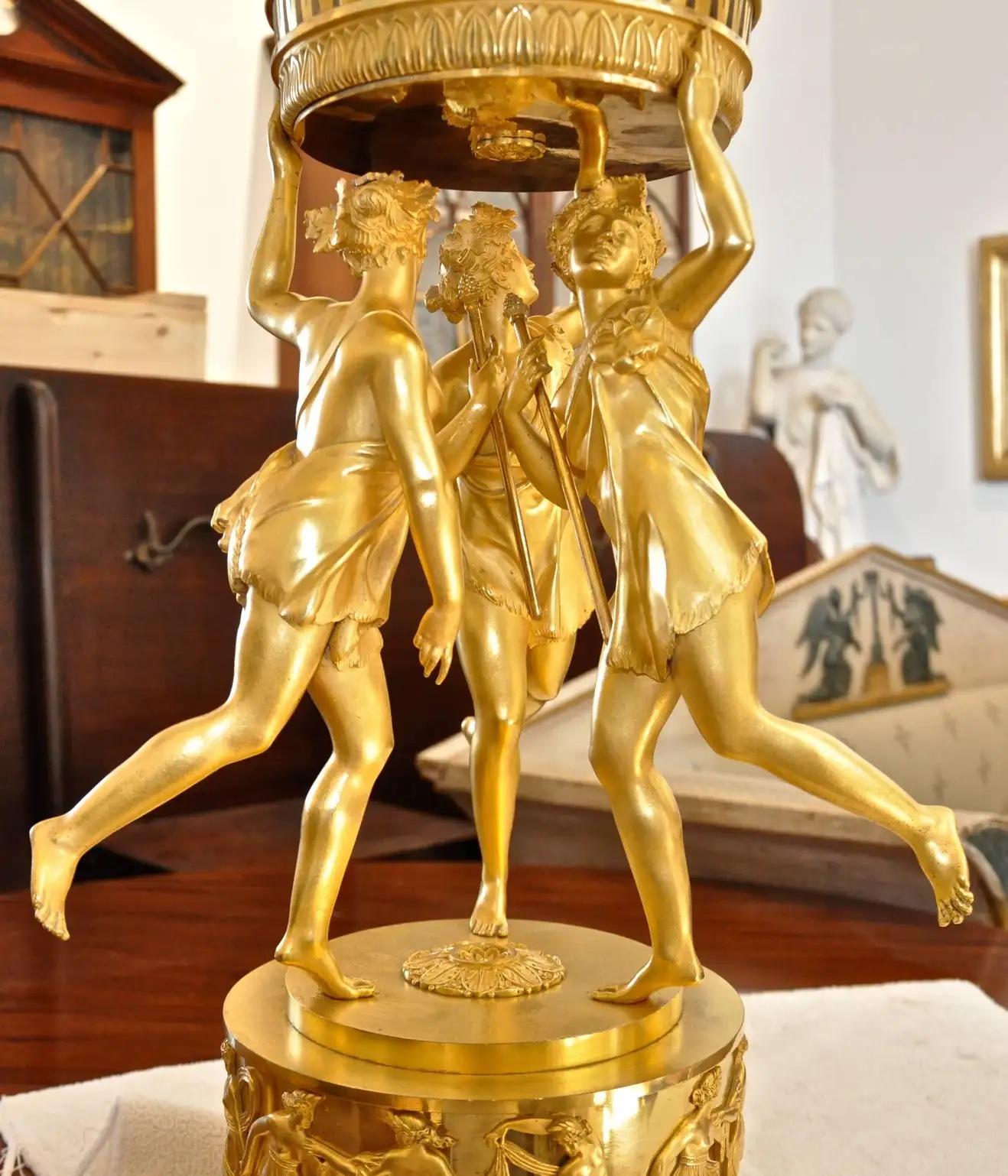 Period first Empire neoclassical ormolu centrepiece by and signed Thomire

Three maenads carrying staffs in dance
Reticulated basket
Amazing dull and shiny gilding
Laurel wreath base.