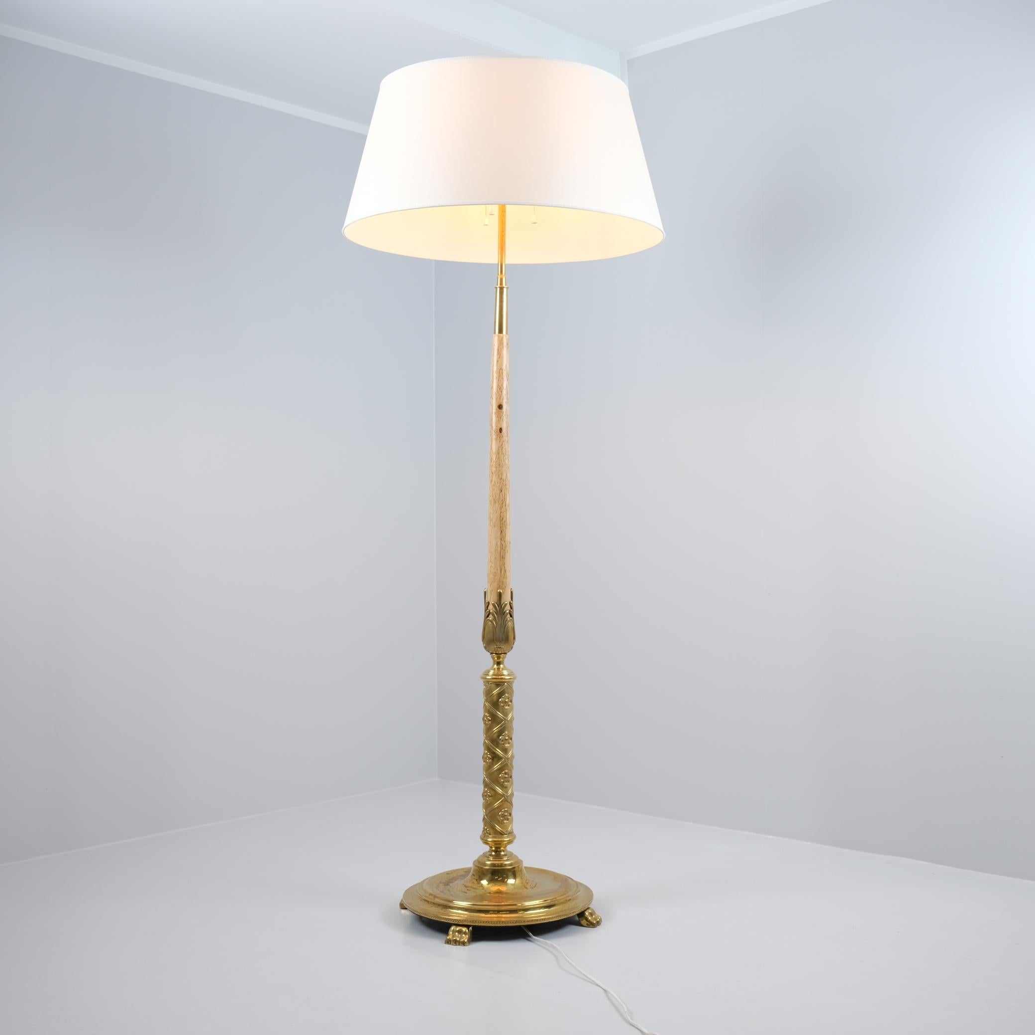 A monumental floor lamp attributed to Paavo Tynell and made by Taito Oy. The lamp is not stamped Taito, however since we attribute it to Tynell, that basically means Taito. Another reason for the attribution is that the decorations on the lower