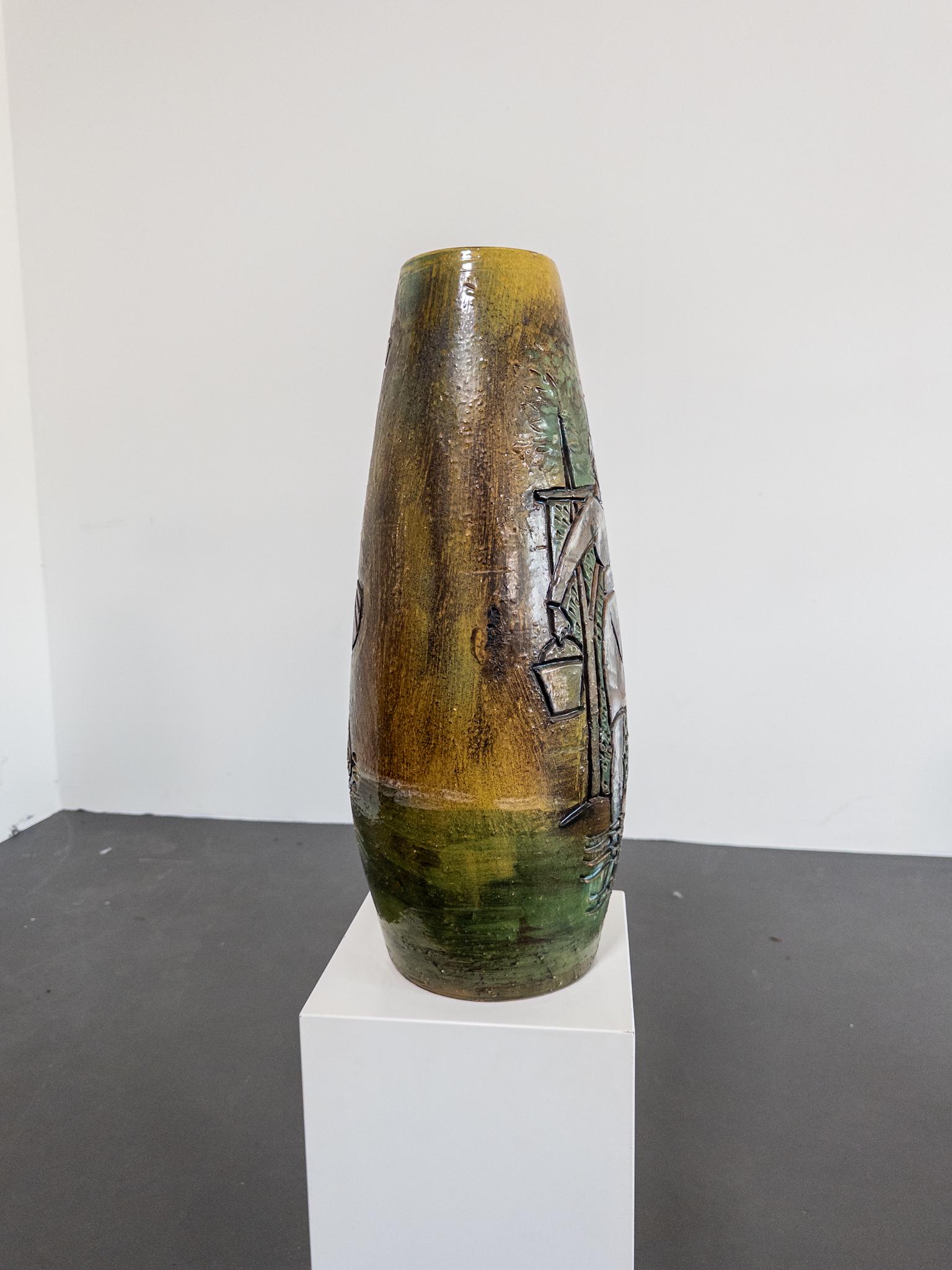 A striking and rare ceramic floor vase by renowned Polish-Canadian artist Marian Zawadzki, dated 1965 and signed M.Z. on the base. This sculptural piece is a powerful example of mid-century European studio pottery, featuring a deeply carved figural