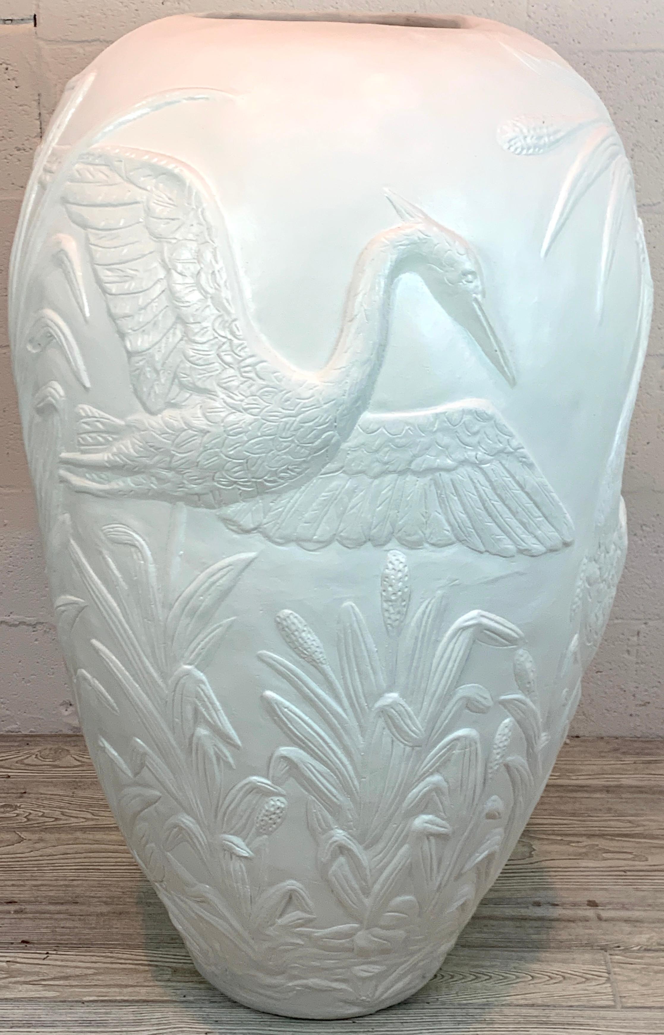 Monumental Florida modern heron vase, circa 1980, with three different detailed vignettes of Herons in naturalistic landscapes. Handmade of spun fiberglass, composition, plaster and lacquer. Standing 45 inches high, with a 25 inch diameter and a 10