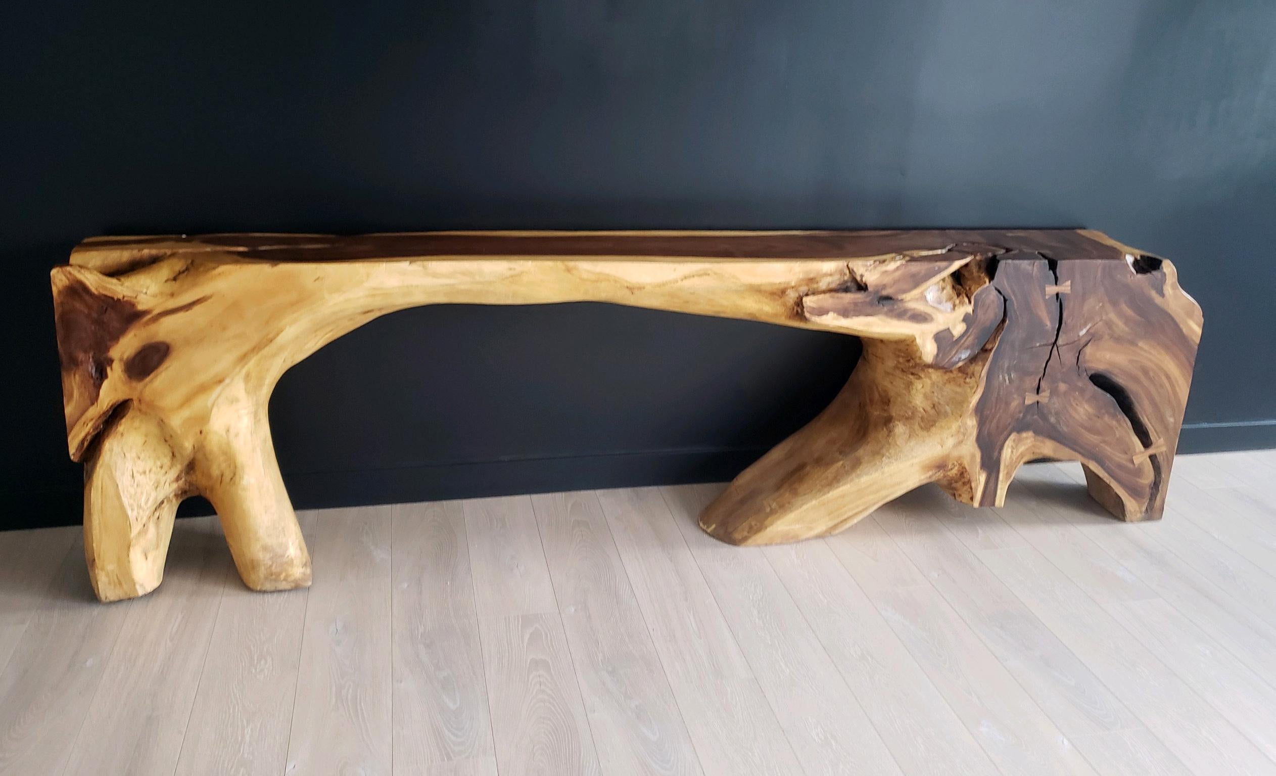 Meet the console table that’s making waves in both style and sustainability. At a staggering 117 inches in length and standing proud at 32 inches tall, this showstopper of a table isn’t here to blend into the background. Carved from a single piece