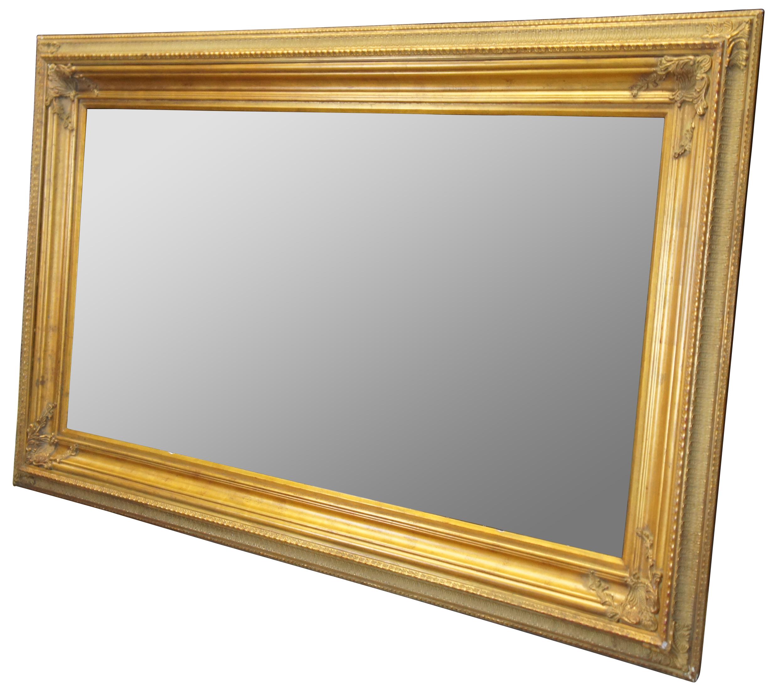 Vintage ornate gold frame. Made of wood with acanthus design and red undertone.

Measures: Opening 36