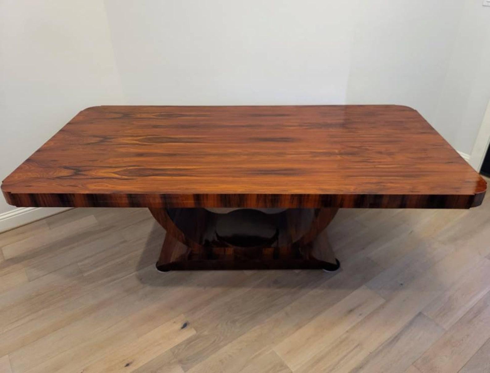 A stunning vintage French Art Deco table in striking palisander / rosewood. Fine Parisian craftsmanship, refined elegant sophistication, luxury, and exotic woods, with its sleek stylized geometric form, clean lines and luxurious polished finish, the