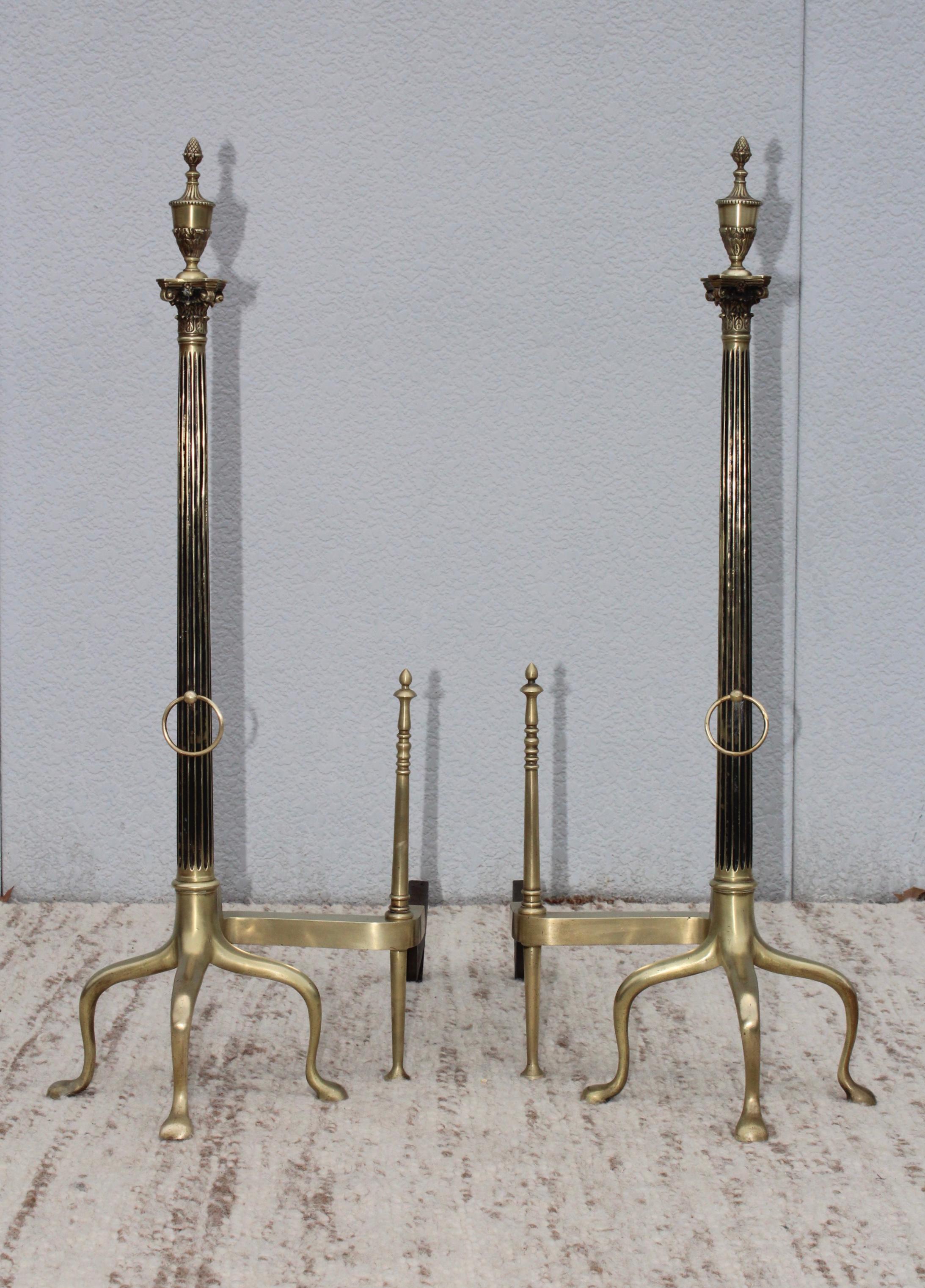 Stunning set of large 1960s mid-century modern French brass andirons, in vintage condition with minor wear and patina due to age and use, lightly hand polished.