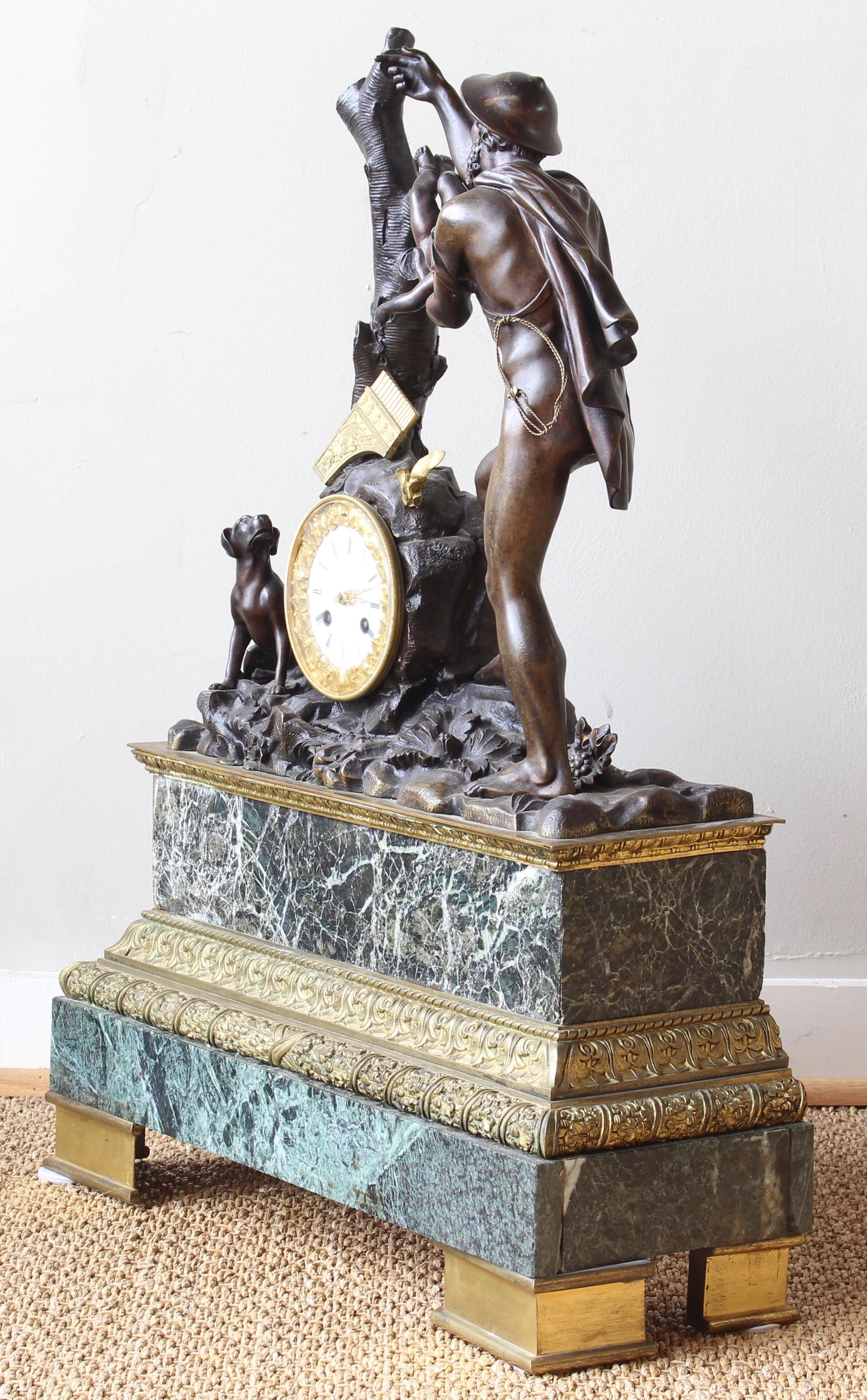 An exceptionally large and impressive late 19th century French patinated bronze classically themed figural clock with gilt bronze accents on Verde marble base.