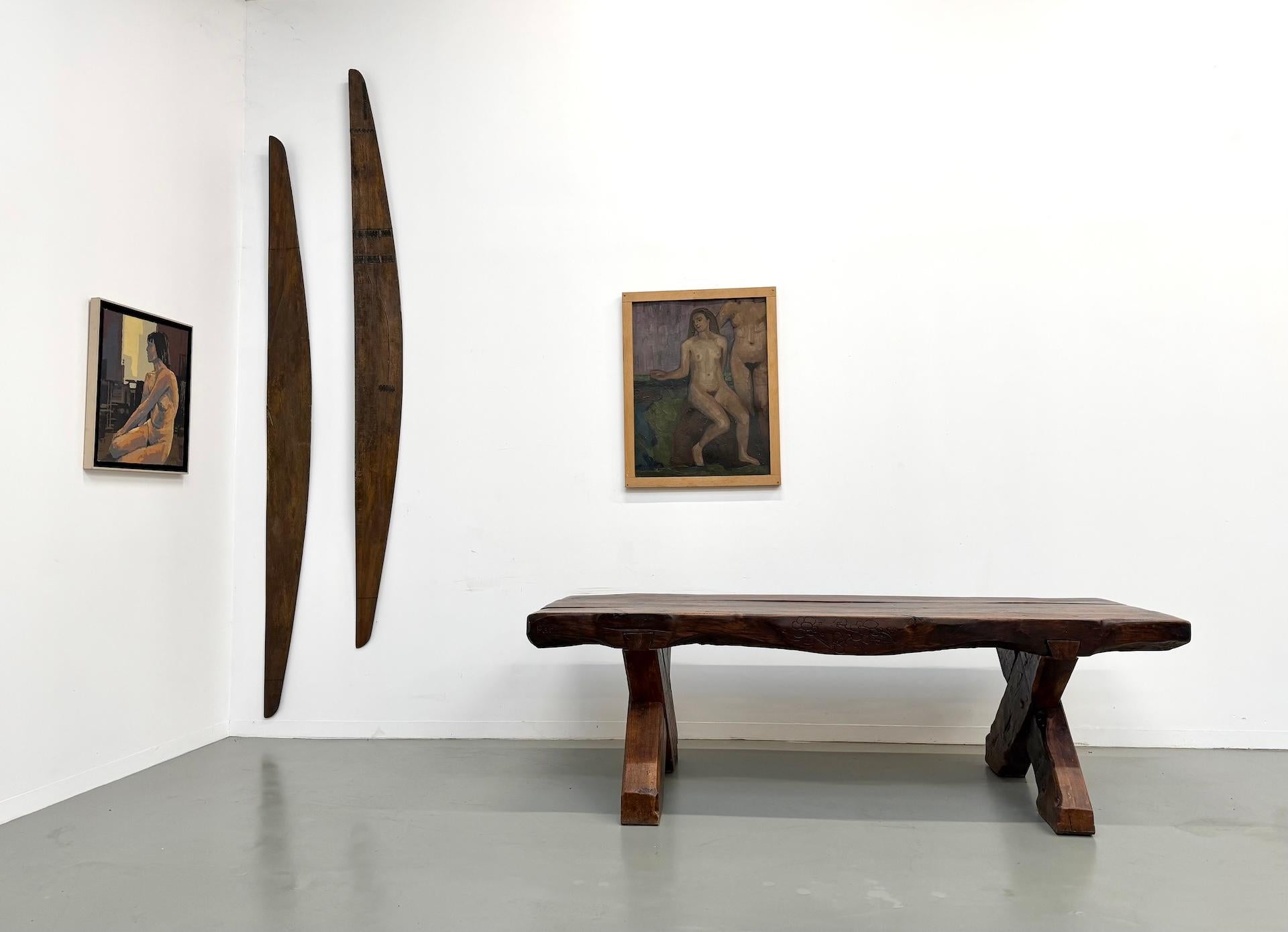 A true piece of functional sculpture, this monumental early 20th-century table is a masterpiece of Folk Art and proto-Brutalism. More than mere furniture, it is a piece of interior architecture that commands the room with its extraordinary