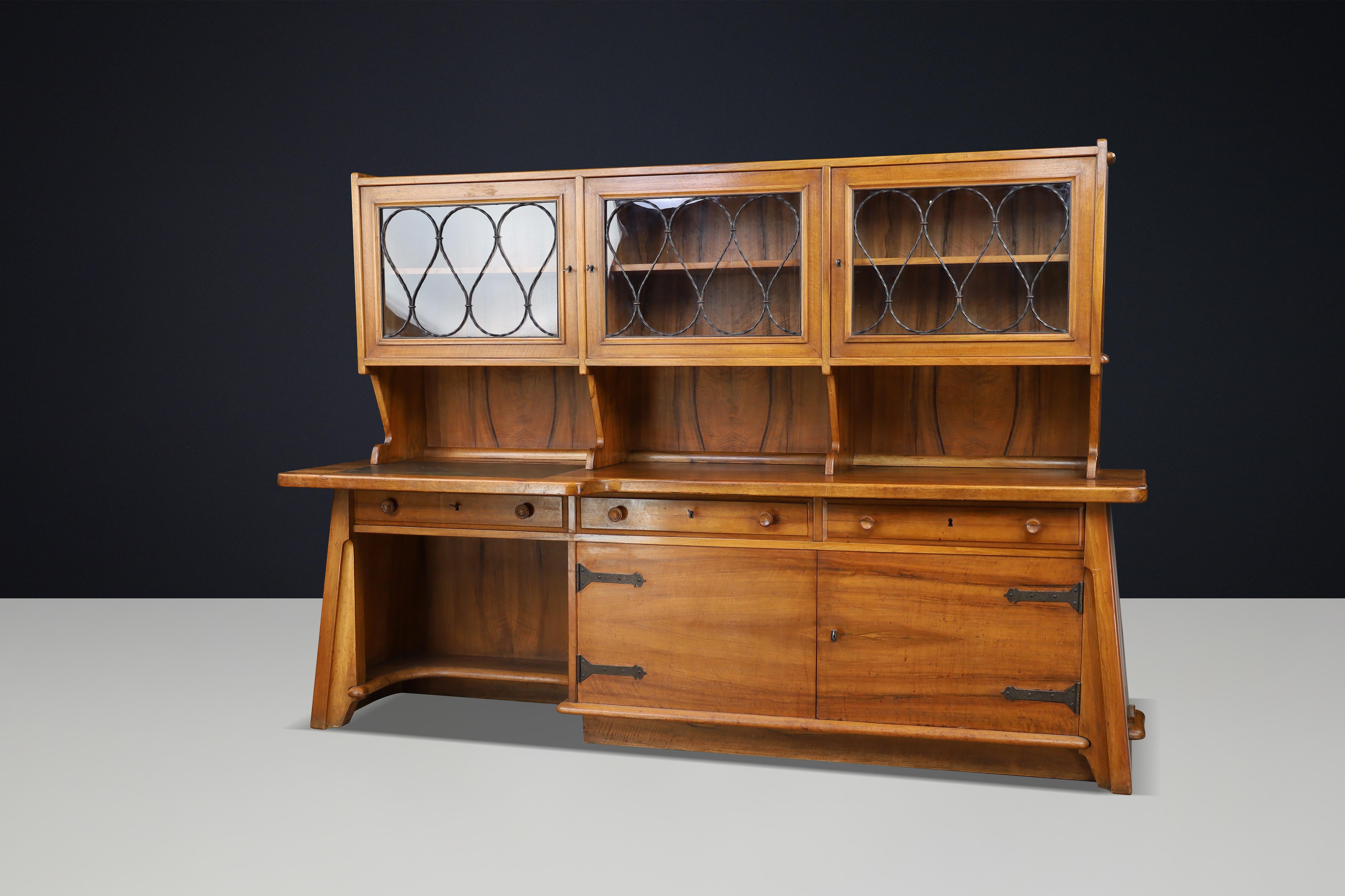 Monumental French Brutalist Walnut Cabinet / Desk, Sculptural Masterpiece, 1950s

A monumental and rare Brutalist cabinet and desk combination, crafted in France during the 1950s. This sculptural masterpiece in solid walnut exemplifies the raw