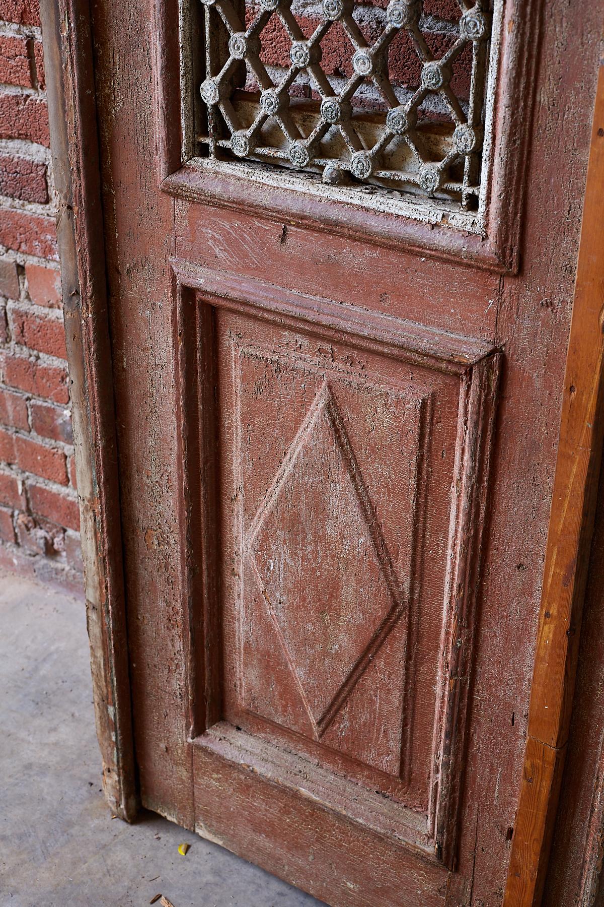 Rustic Monumental French Doors and Transom with Iron Grills