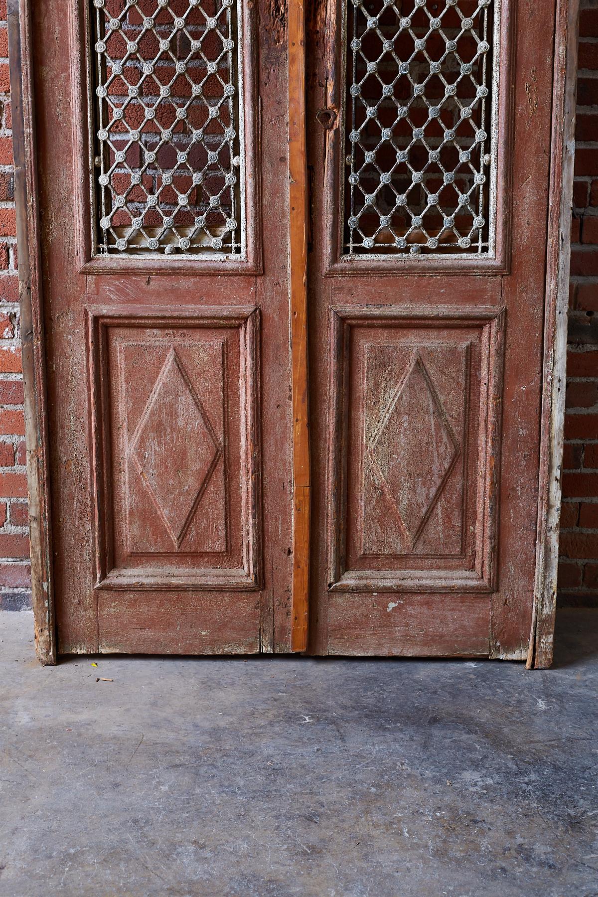 Monumental French Doors and Transom with Iron Grills In Distressed Condition In Rio Vista, CA