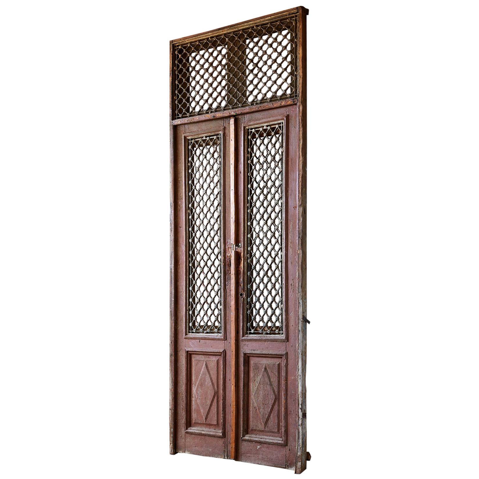 Monumental French Doors and Transom with Iron Grills