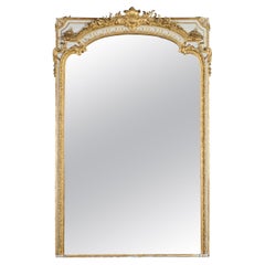 Monumental miroir de sol en bois doré de style Louis XVI