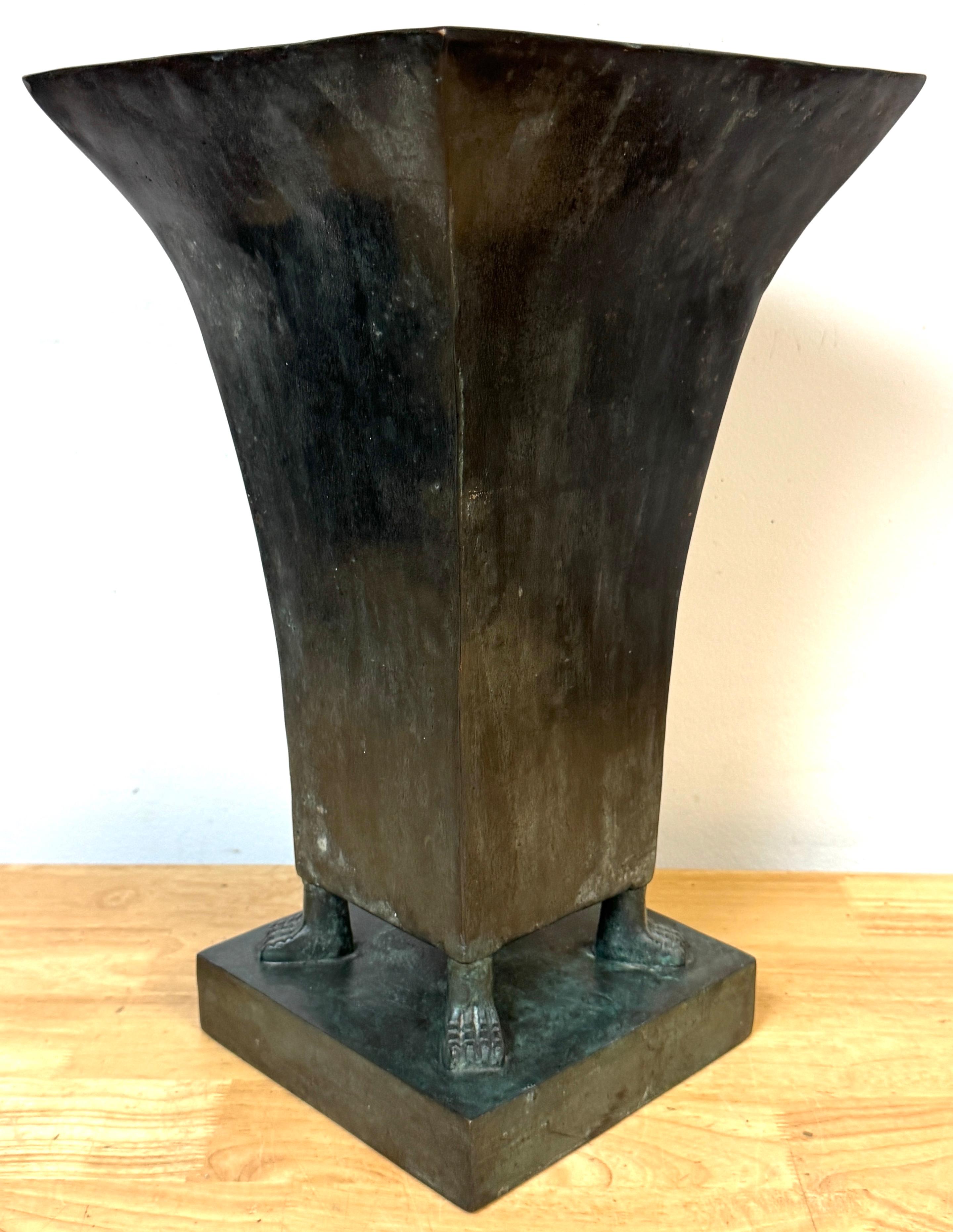 Monumental French Moderne Bronze Vase with Verdigris Patina, in the Manner of Gilbert Poillerat, 1950s

A striking French Moderne cast bronze vase of impressive weight and presence, standing 18 inches tall and weighing 36 pounds. The bold flaring