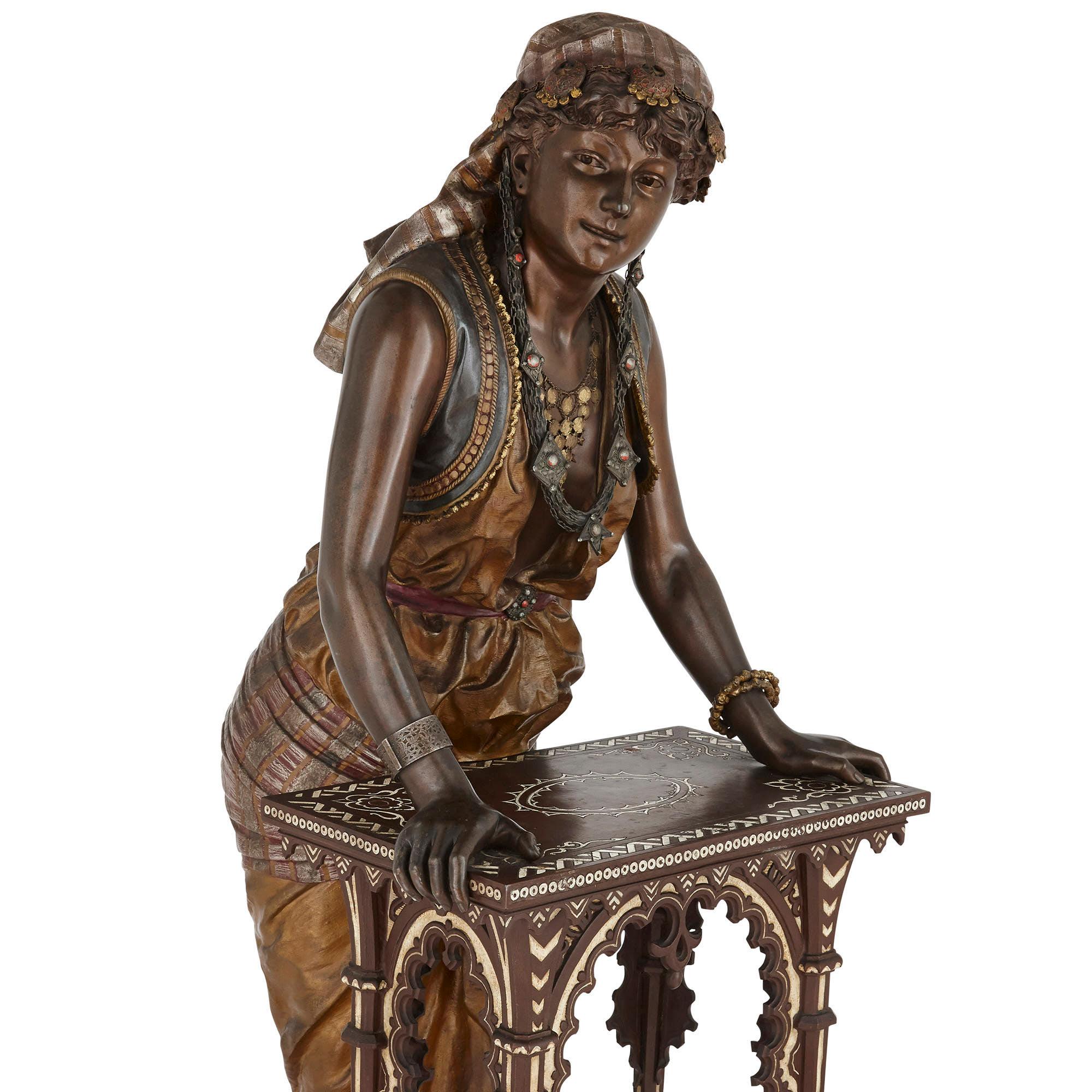 Monumental French sculpture of a female figure with table by Louis Hottot
French, late 19th century
Measures: Height 145cm, width 51cm, depth 57cm

Cast by the renowned sculptor Louis Hottot (French, 1829-1905), this beautiful Orientalist