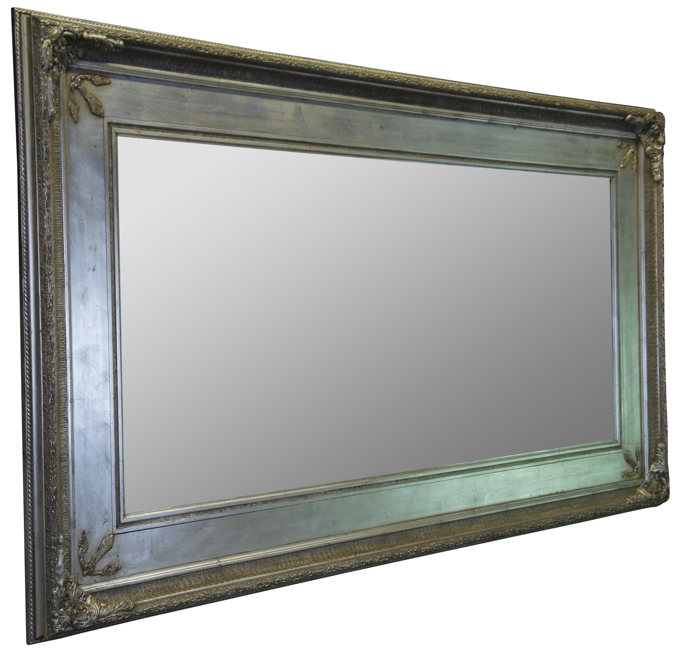 Transitional French inspired full length mirror. Finished in silver with acanthus leaf carvings.
 