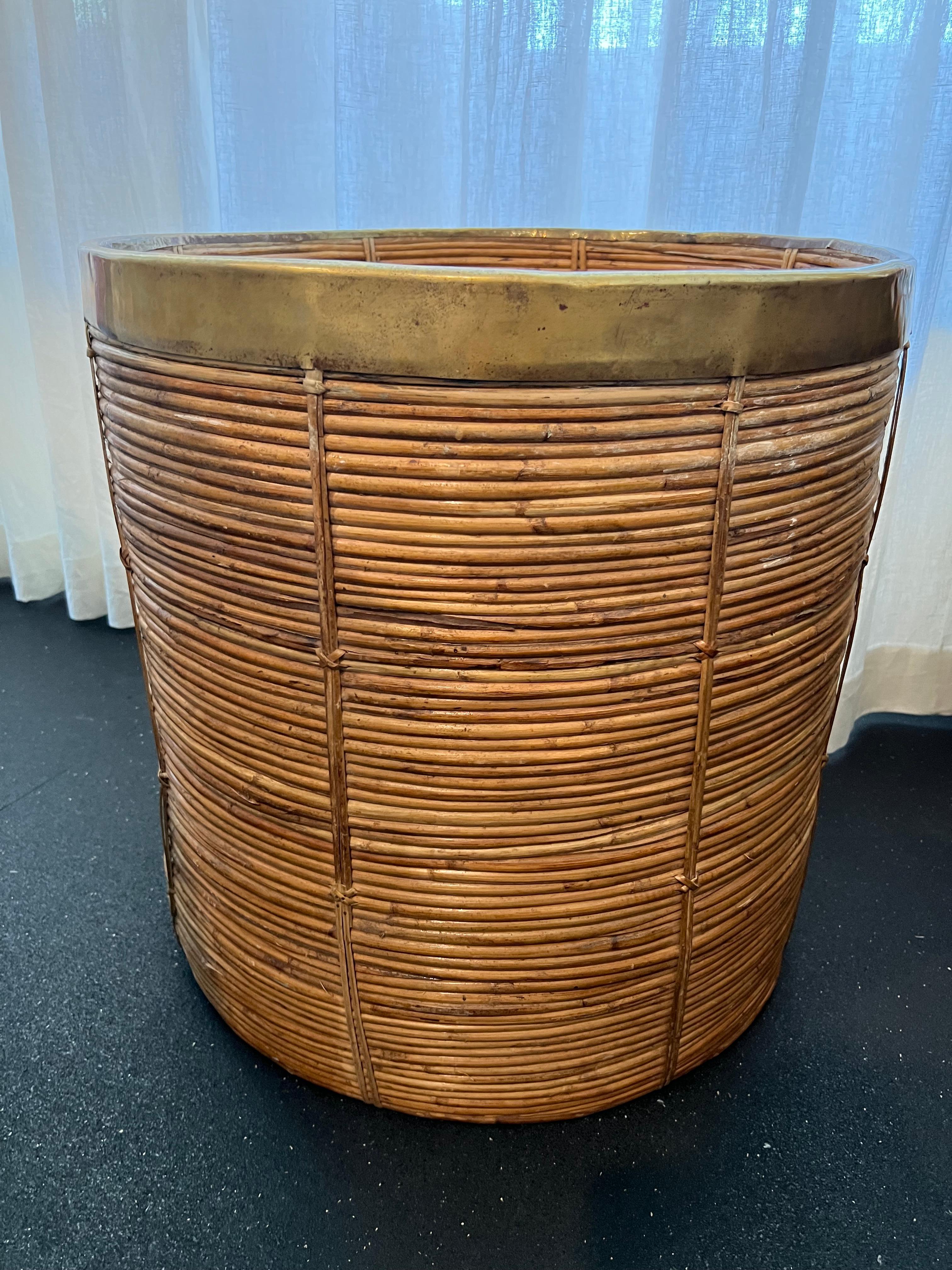Monumental Gabriella Crespi style pencil reed basket with brass accents. Rare form. Additional photos available upon request.

Would work well in a variety of interiors such as modern, mid century modern, Hollywood regency, etc. Piece blends