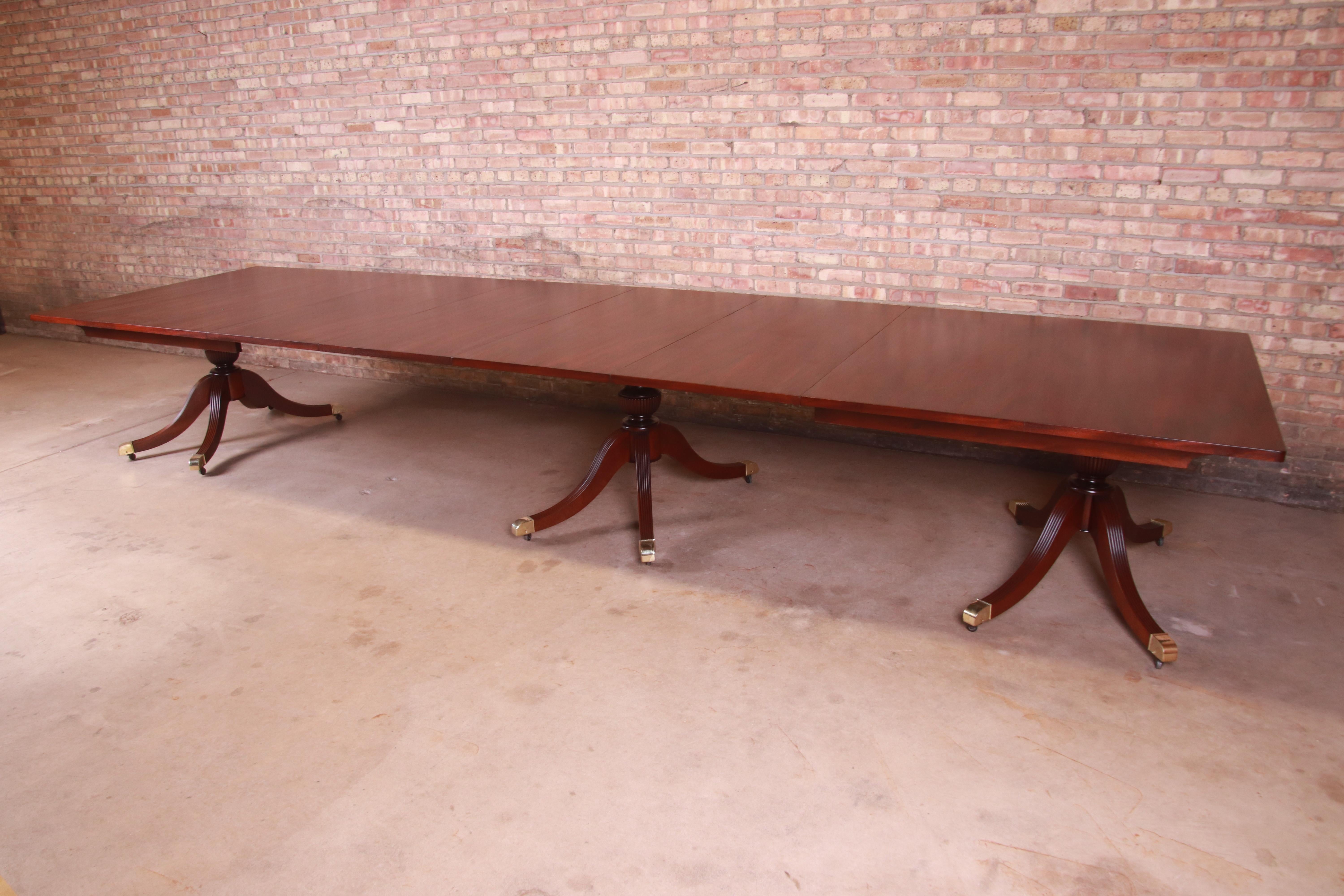 Monumental Georgian Mahogany Triple Pedestal Dining or Banquet Table, Refinished In Good Condition In South Bend, IN