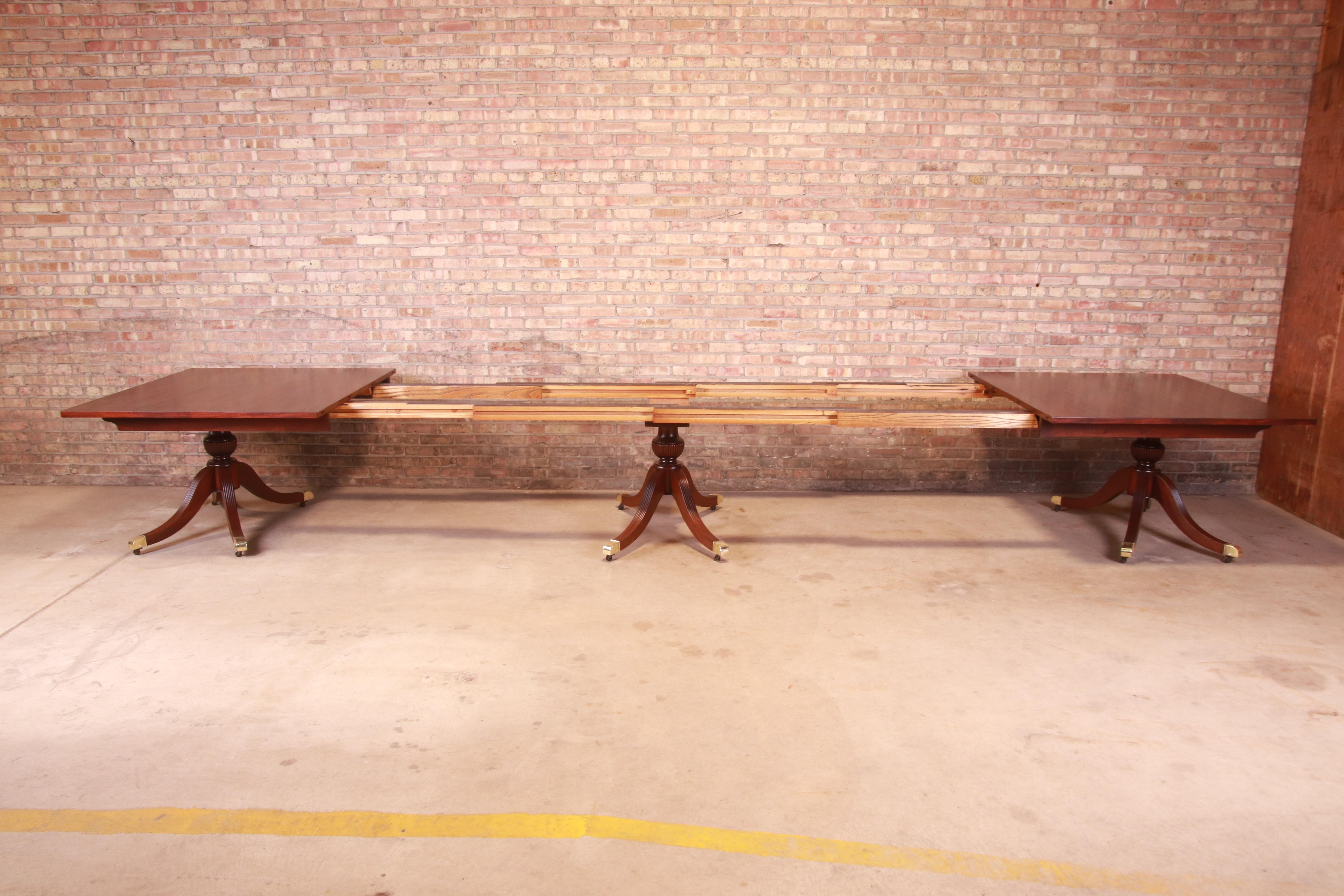 Brass Monumental Georgian Mahogany Triple Pedestal Dining or Banquet Table, Refinished