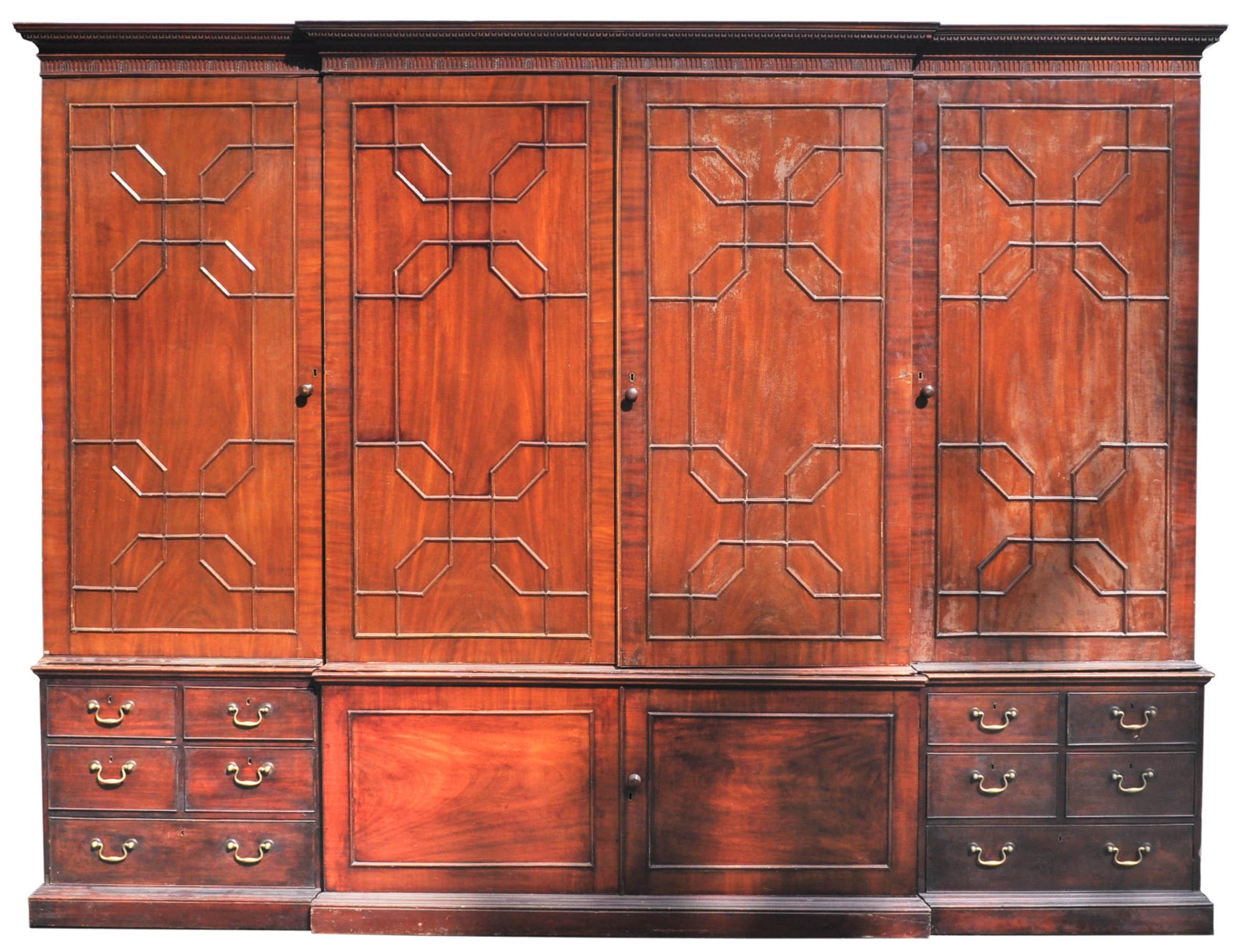 A must have for the Bibliophile! Monumental Georgian style antique mahogany breakfront Bookcase/Cabinet, circa 1880. The bookcase comprised of seven sections for ease of movement and made of the finest 'flame' mahogany, the cornice having dentil