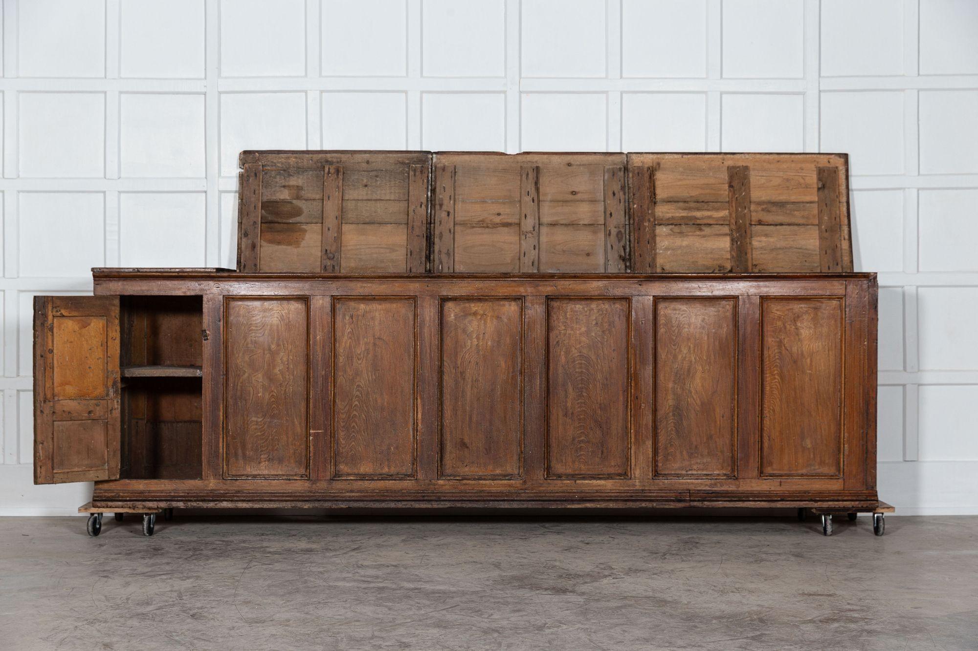 circa 1820
Monumental pine Georgian Welsh farm house grain chest counter.
Provenance: Large Farm Estate - Anglesey, North Wales.
An outstanding rare example with its form, scale and grained paintwork on the open market for the first time in its