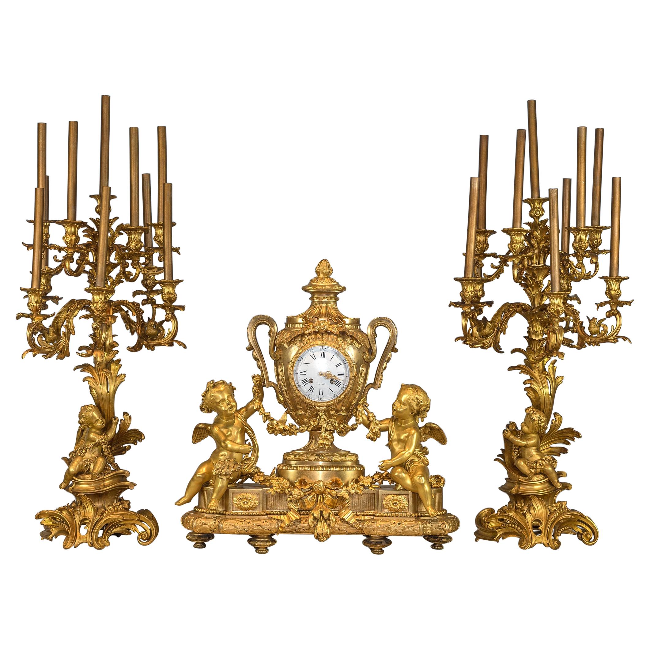 Monumental Gilt Bronze Clockset with Putti Playing with Flower Garlands For Sale
