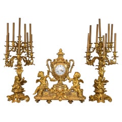Monumental Gilt Bronze Clockset with Putti Playing with Flower Garlands