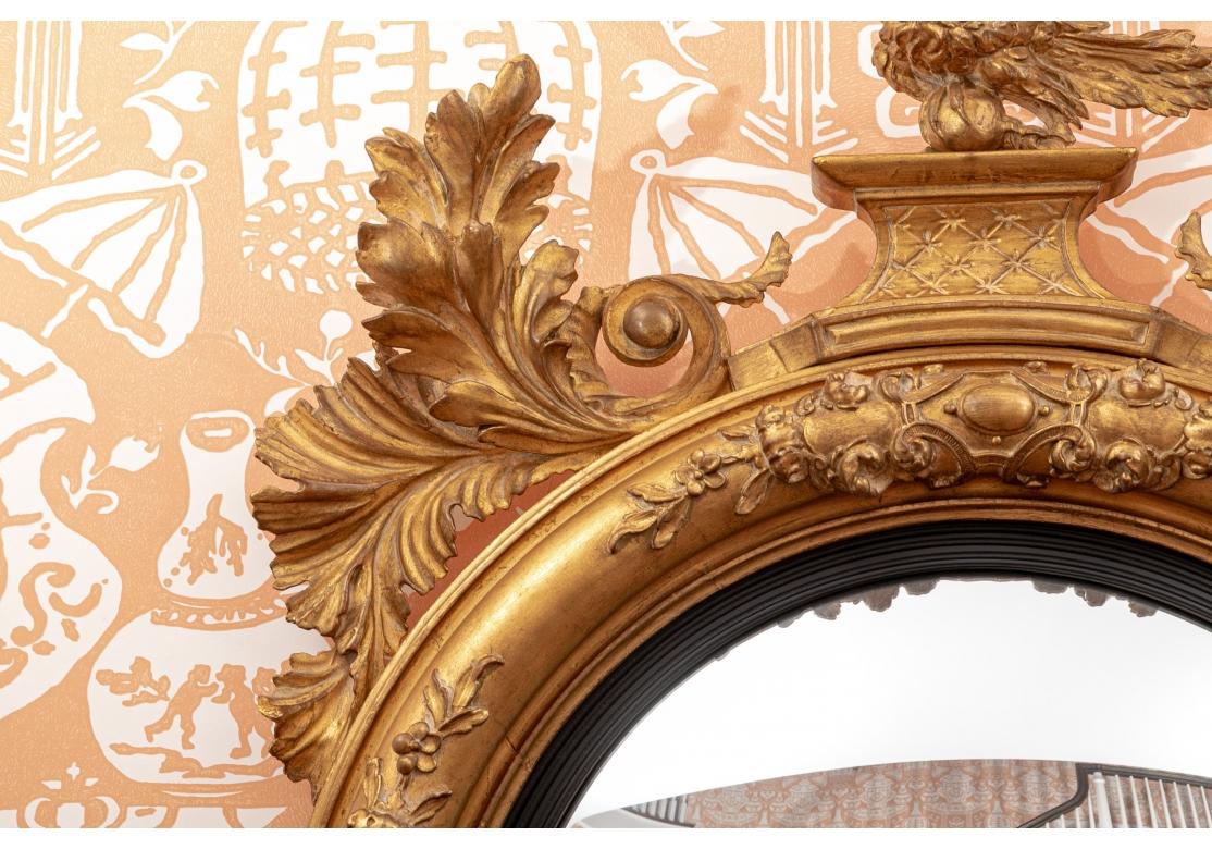 American Classical Monumental Gilt & Ebonized Convex Mirror with Eagle For Sale