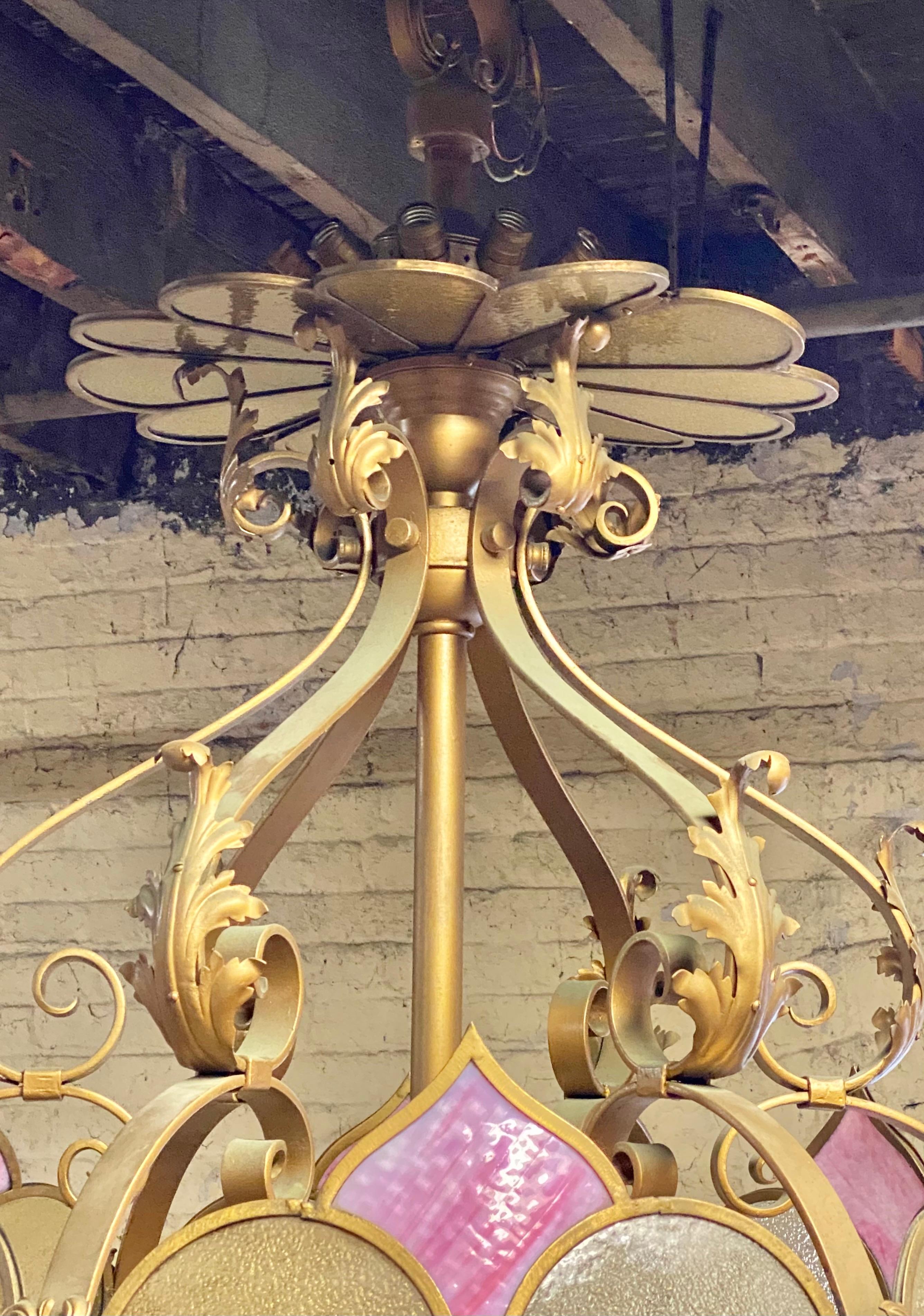 Monumental oversized ...glass and iron deco/ Victorian fantasy chandelier / pendant lighting, Salvaged from theater, outrageous fantasy chandelier, featuring decorative gilt iron frame, slag glass, stain glass, minor cracks to a couple of small