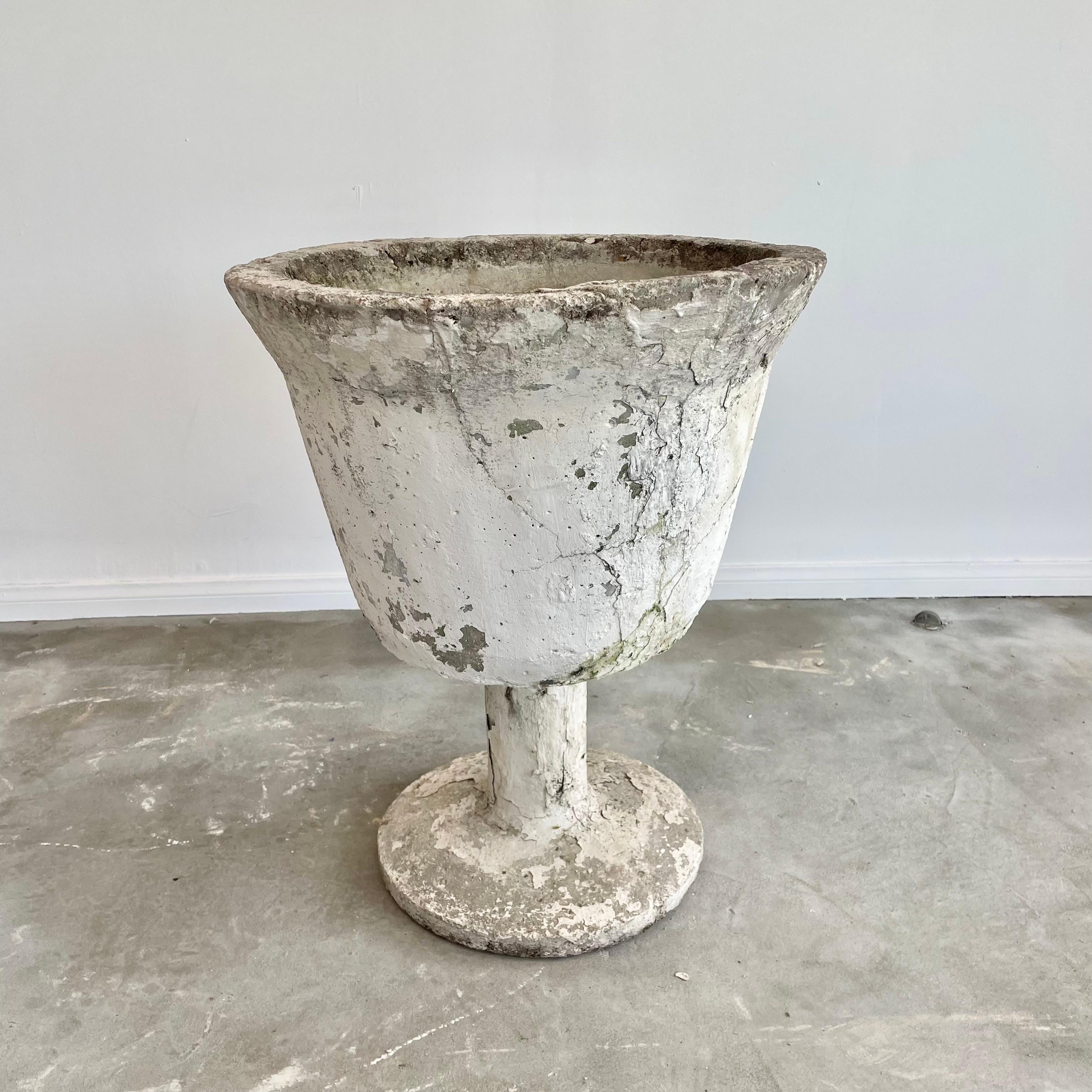 Monumental concrete goblet planter with an incredible patina. An unusual planter in a massive size. After spending decades in the elements, each goblet has great patina and weathering giving it an antique victorian feel while at the same time having