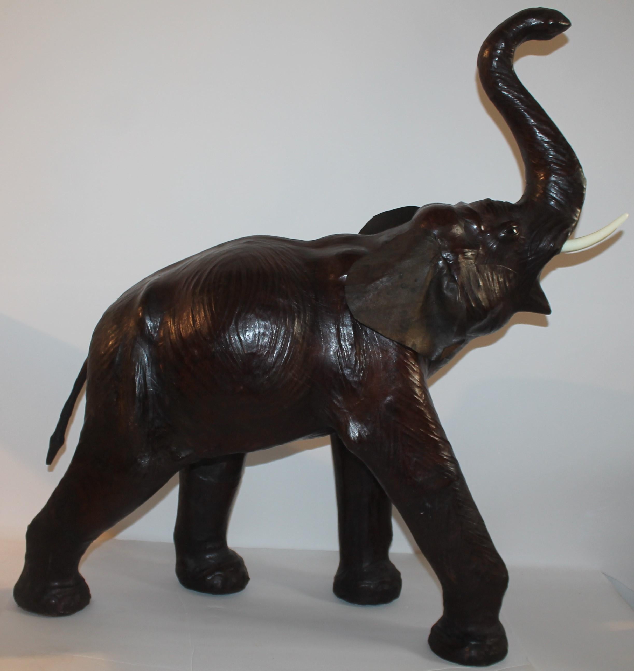 This large leather elephant is in fine as found condition. It looks like a real life baby elephant.