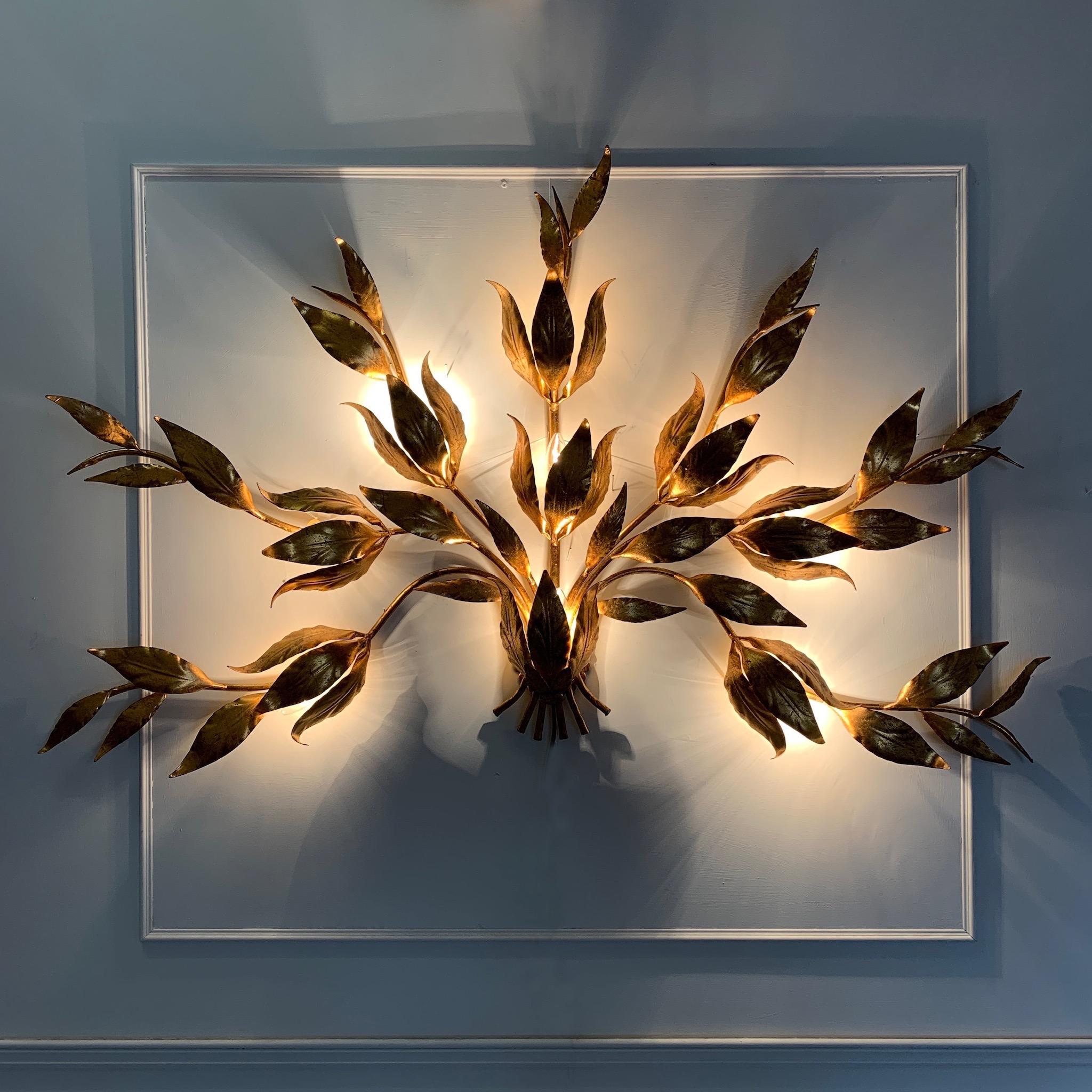 Monumental Hans Kogl leaf wall sconce, 1970s
Hans Kogl, Germany
This very large and beautiful leaf sconce is a real statement piece
There are 7 handcrafted curved gilt stems decorated fully with gilt leaves

Measures: 144cm width, 83cm height, 18cm