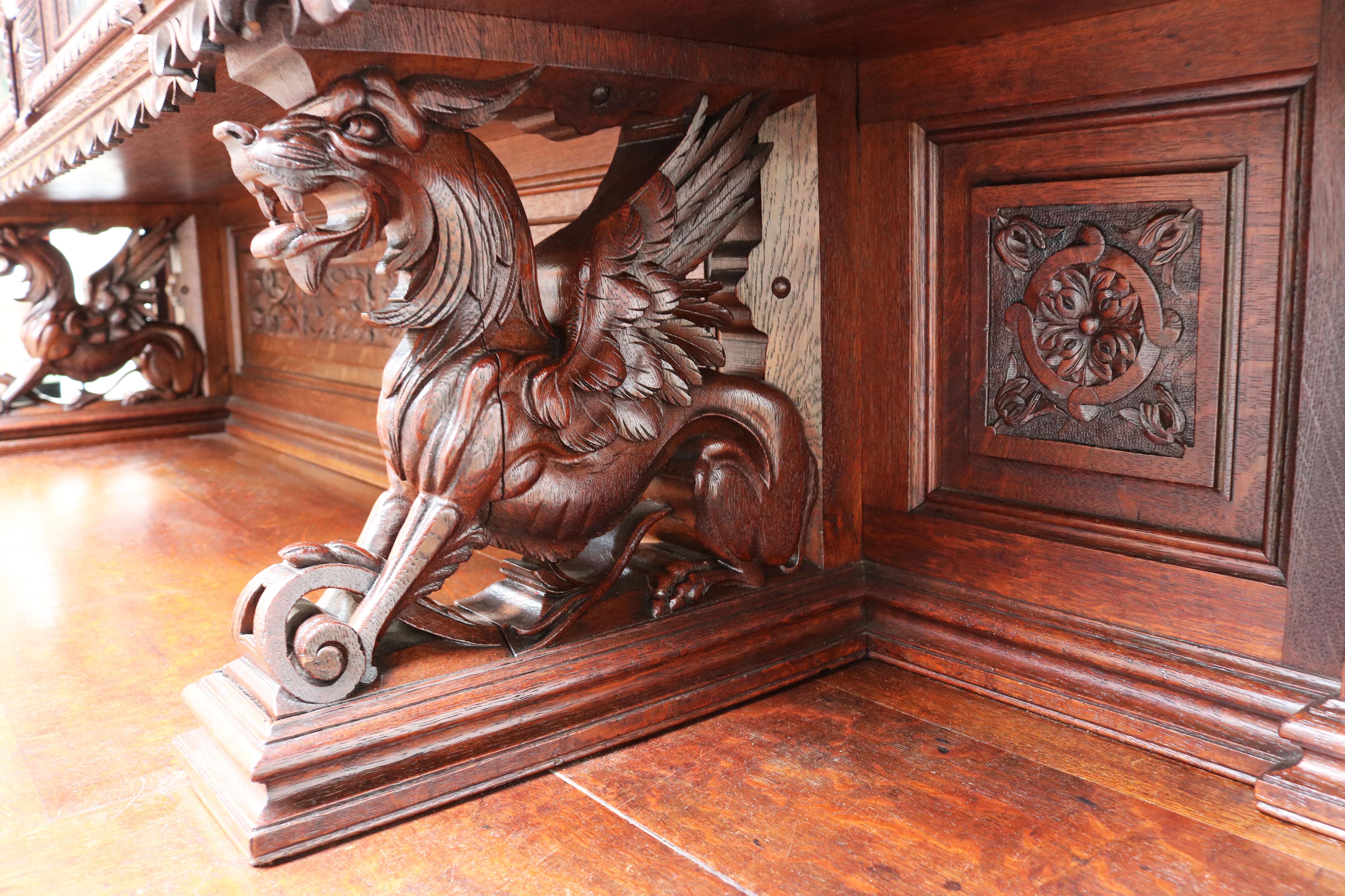 Rare monumental Hunt style Renaissance Revival cabinet by Alexander Roux 1870 museum quality piece. 
Carved out of solid oak with numerous rich details and stunning craftsmanship by a master carver. 

The bottom of the cabinet has 2 bent doors en