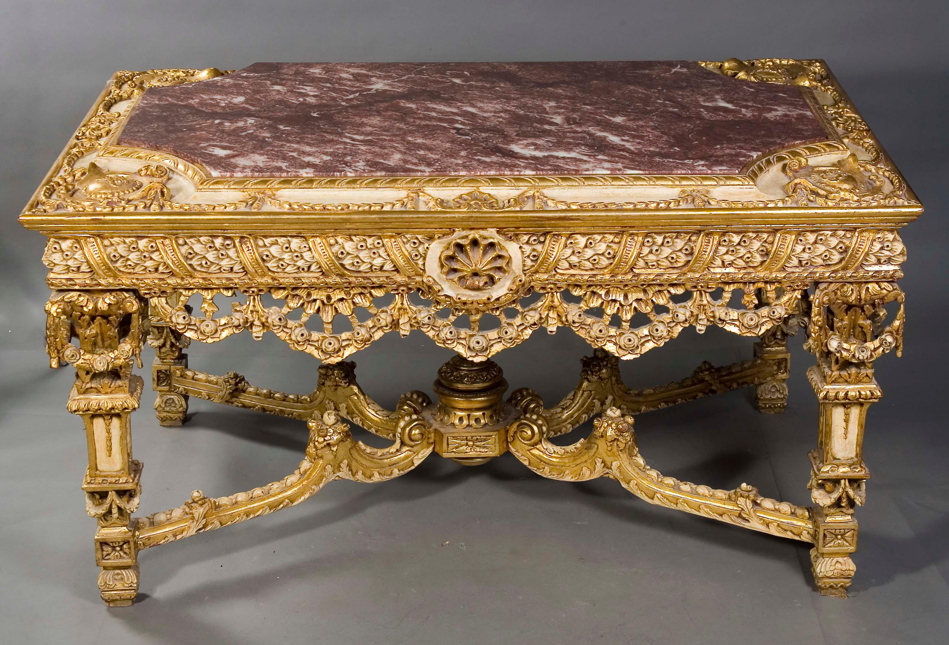 Monumental, impressive Splendid-Salon-Table in Louis XVI Style
Highly valuable solid Beech Wood, carved in the finest detail. Beige
colored handpainted and gilded. On conical shaped, carved legs, joined with X-formed, strongly carved wooden middle