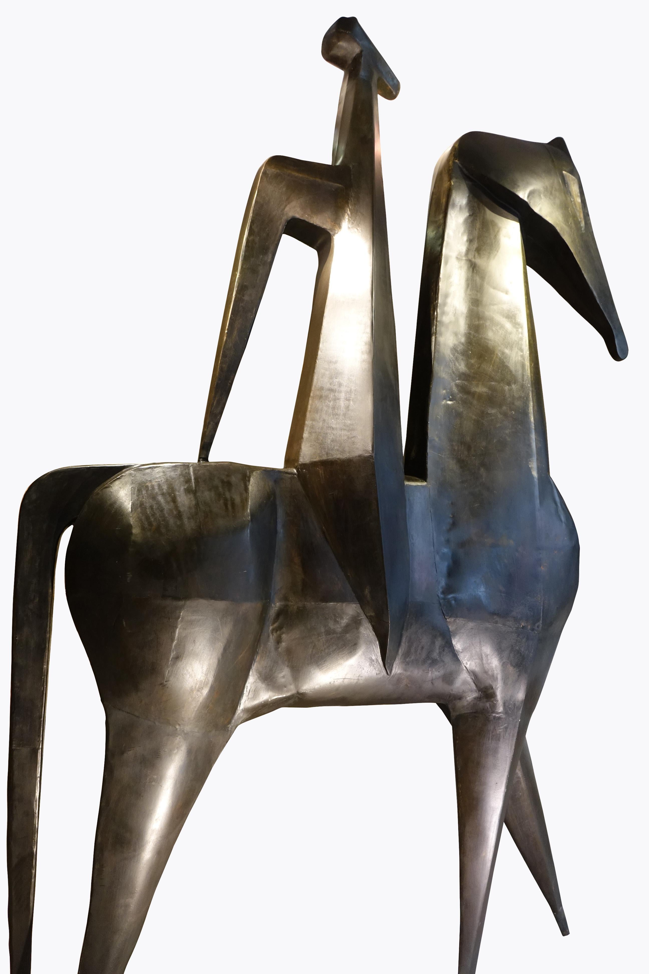 Monumental sculpture (height 2.50m) representing a horseman.
Iron patinated bronze, signed inside a leg H. AMBROSIO, 1967.
The design is very stylized, with angular contours. There is an impression of strength and purity.
It may be a decor for a