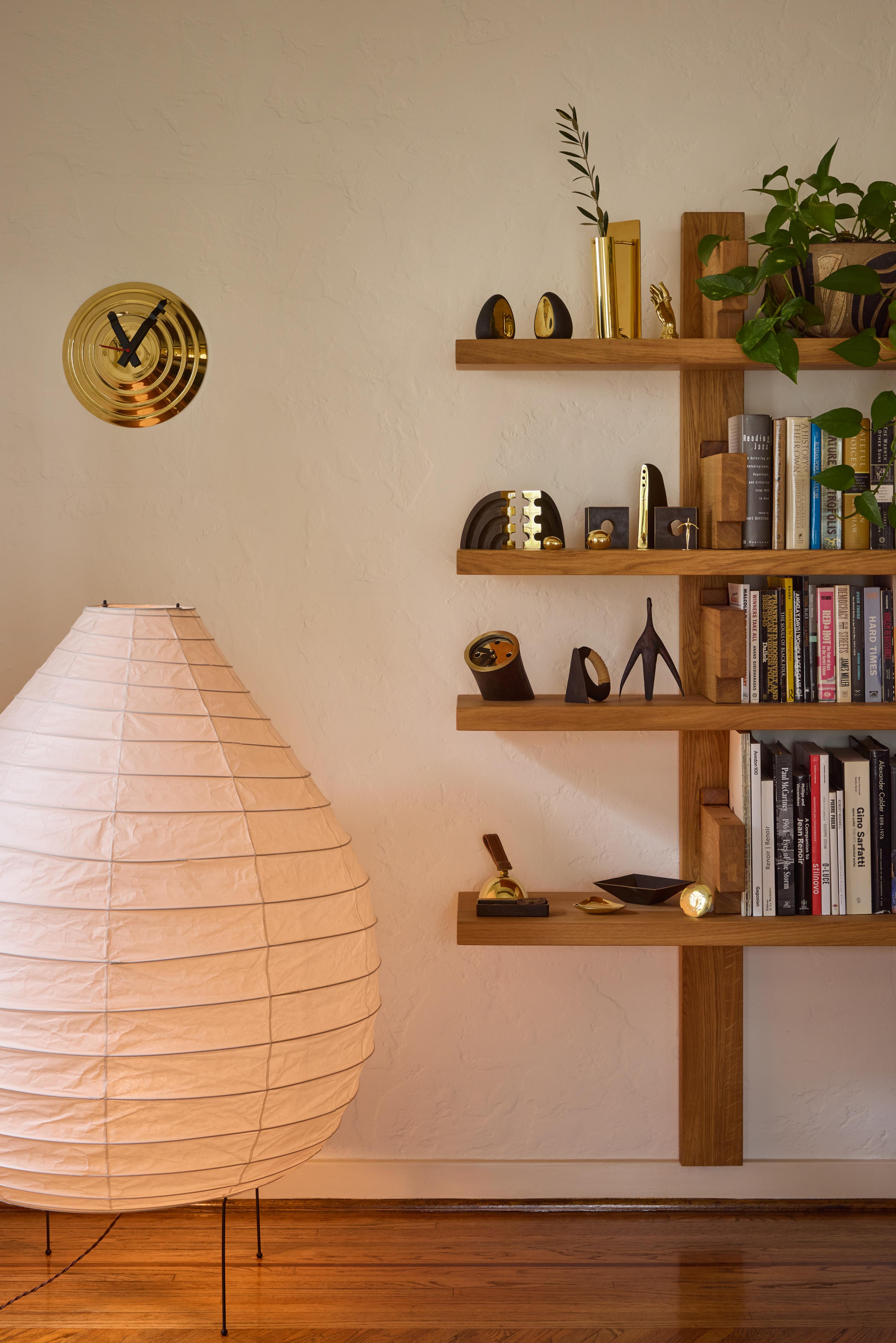 Large Isamu Noguchi Akari 23N floor lamp. Executed in handmade washi paper and bamboo ribs with original Noguchi Akari manufacturer's stamp and metal legs. 

Akari light sculptures by Isamu Noguchi are considered icons of 1950s modern design.