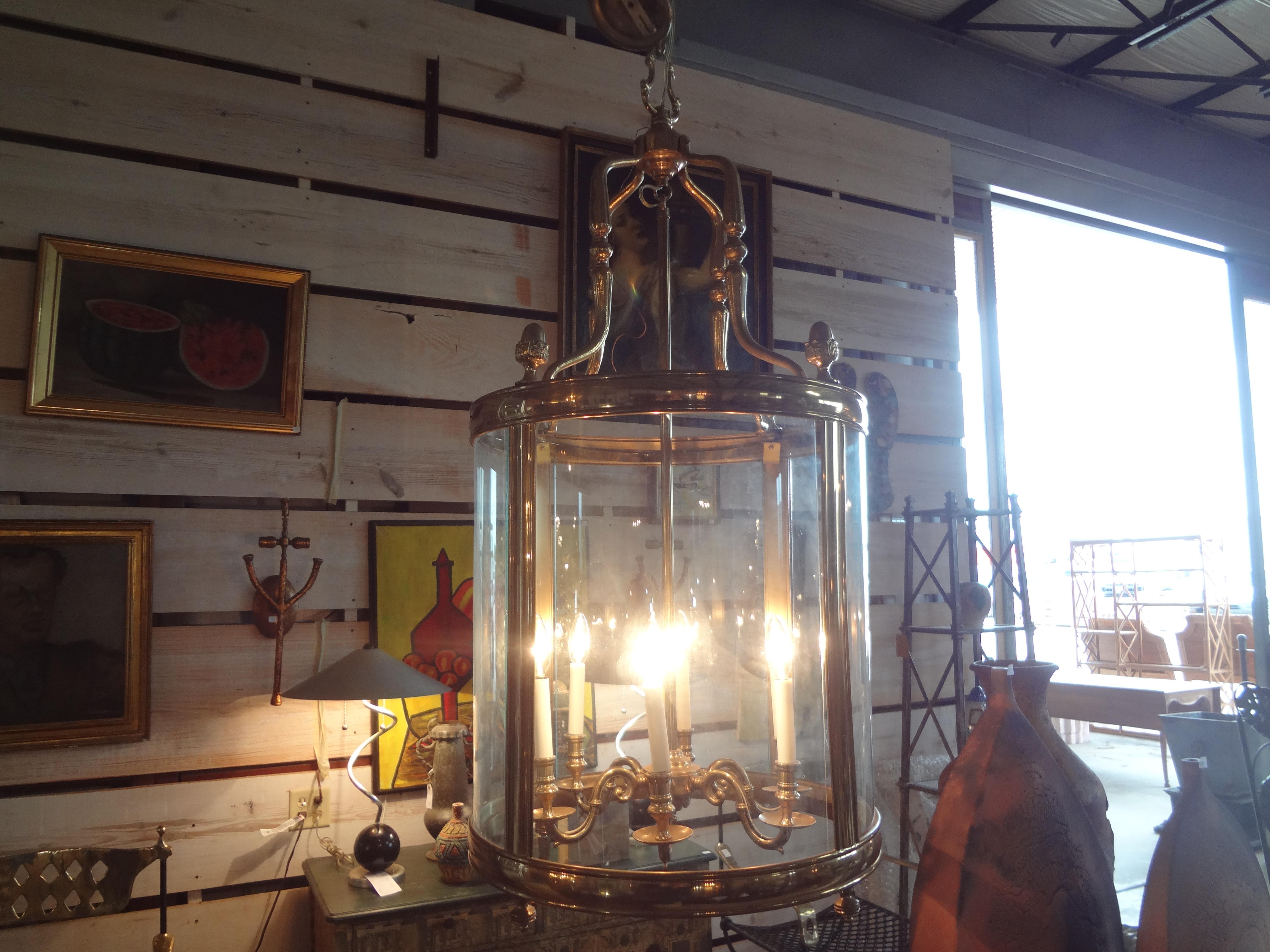 Monumental Italian Brass And Glass Lantern.
This huge 20th century Italian brass chandelier has beautiful curved glass panels and acorn finials. This lantern comes with 3 feet of brass chain.
Stunning!
Perfect entrance hall fixture!