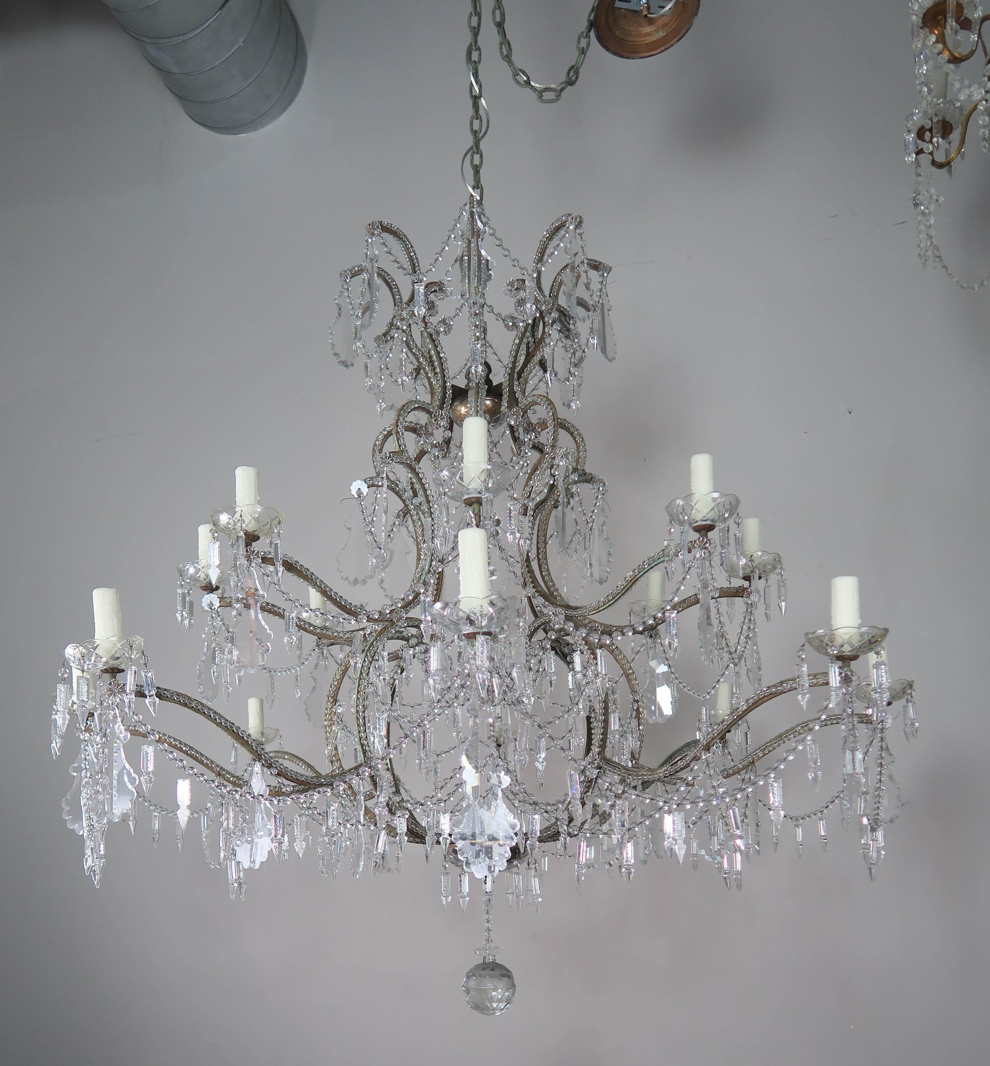 Monumental Italian (16) light crystal beaded arm chandelier adorned with etched spheres dangled from garlands of crystal balls. 6