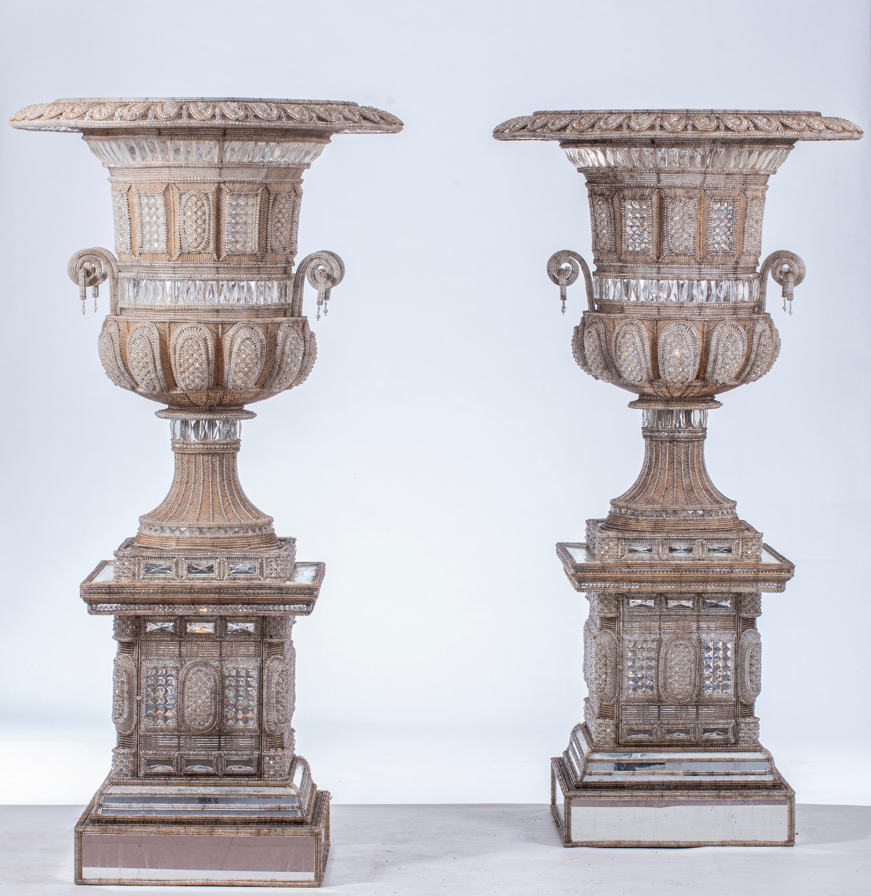 Stunning piece of two monumental Italian cut-glass and beaded vases on glass stand, fitted as lamps.
Decorated overall with geometric panels, each with a foliate rim above an urn shaped body flanked by handles on a waisted stem and square base,