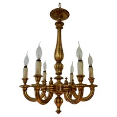 Lustre monumental en bois doré italien