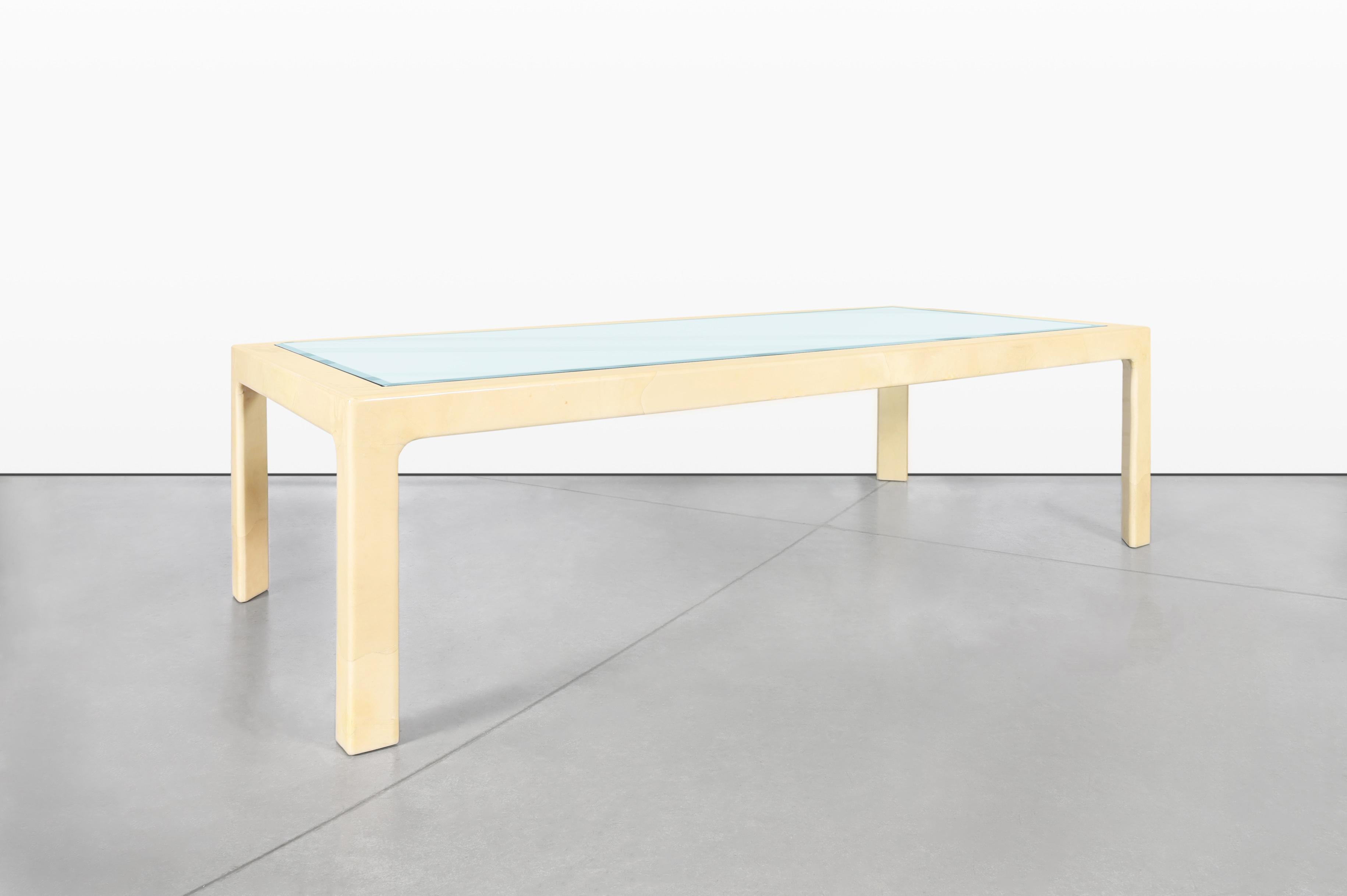 Introducing a stunning vintage goatskin dining table, a remarkable piece inspired by the renowned designer Aldo Tura and beautifully crafted in Italy during the 1970s. This exceptional table, measuring an impressive 9 feet in length, exemplifies the