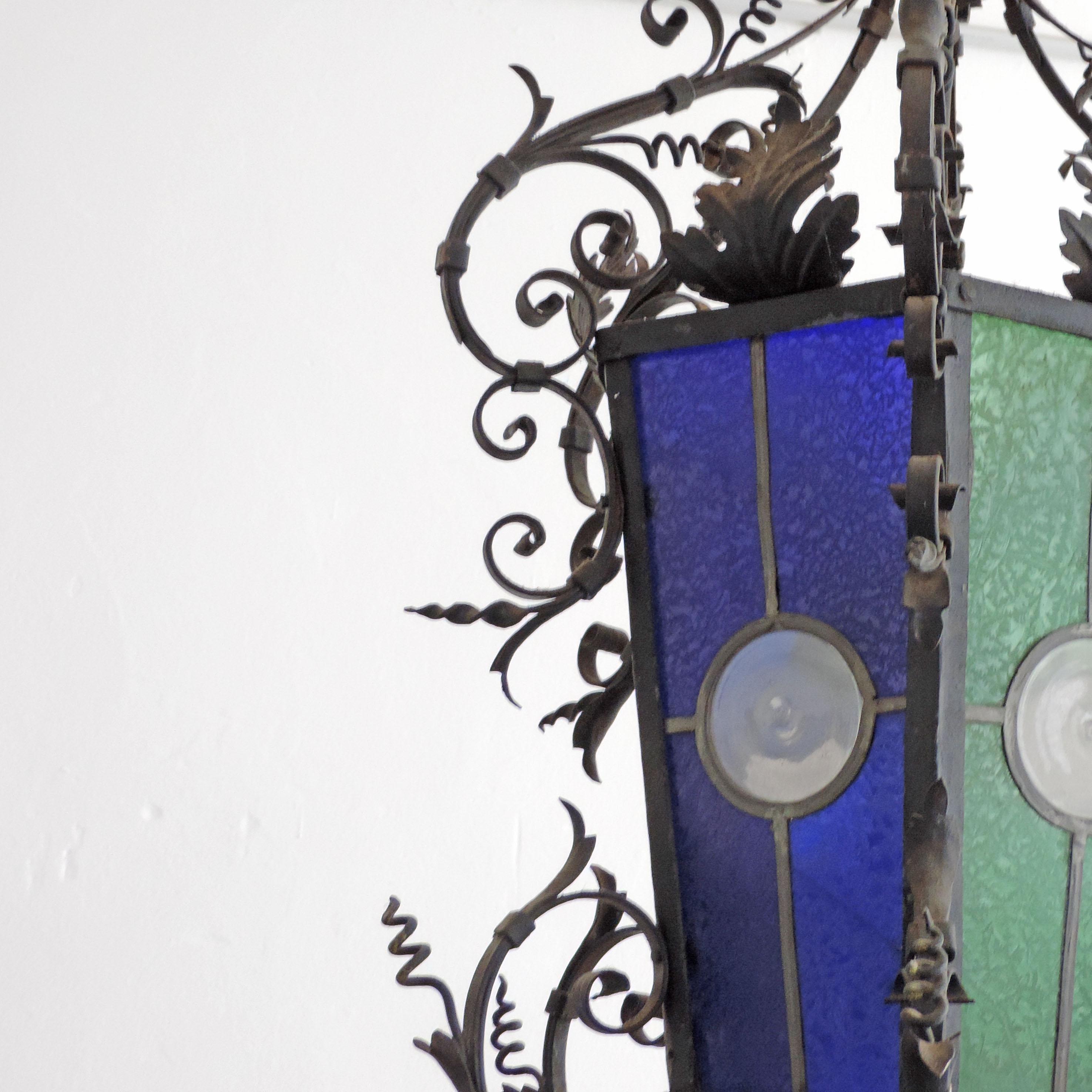 Early 20th Century Monumental Italian Lantern in Wrought Iron and Stained Glass For Sale