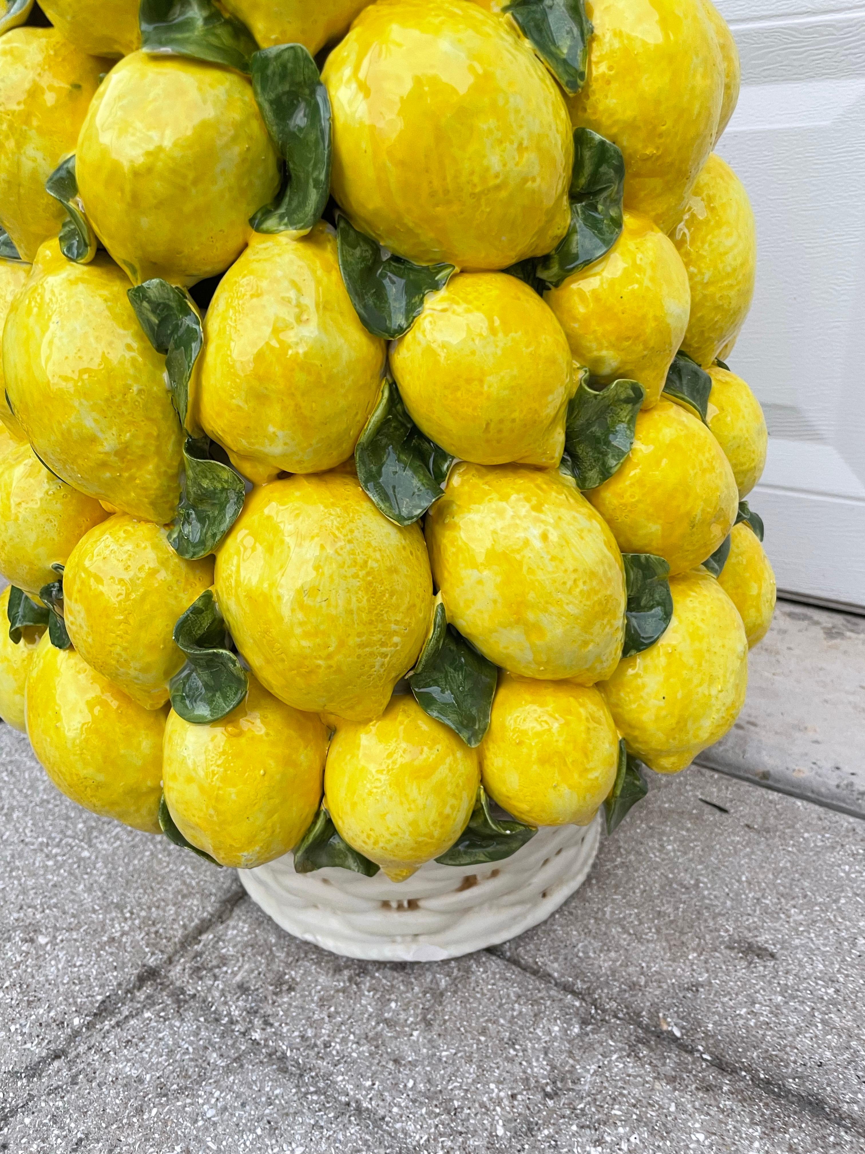 Monumental glazed terracotta lemon topiary centerpiece. This Italian made piece is a very rare size. A very striking centerpiece for all occasions. Very impressive 30.50