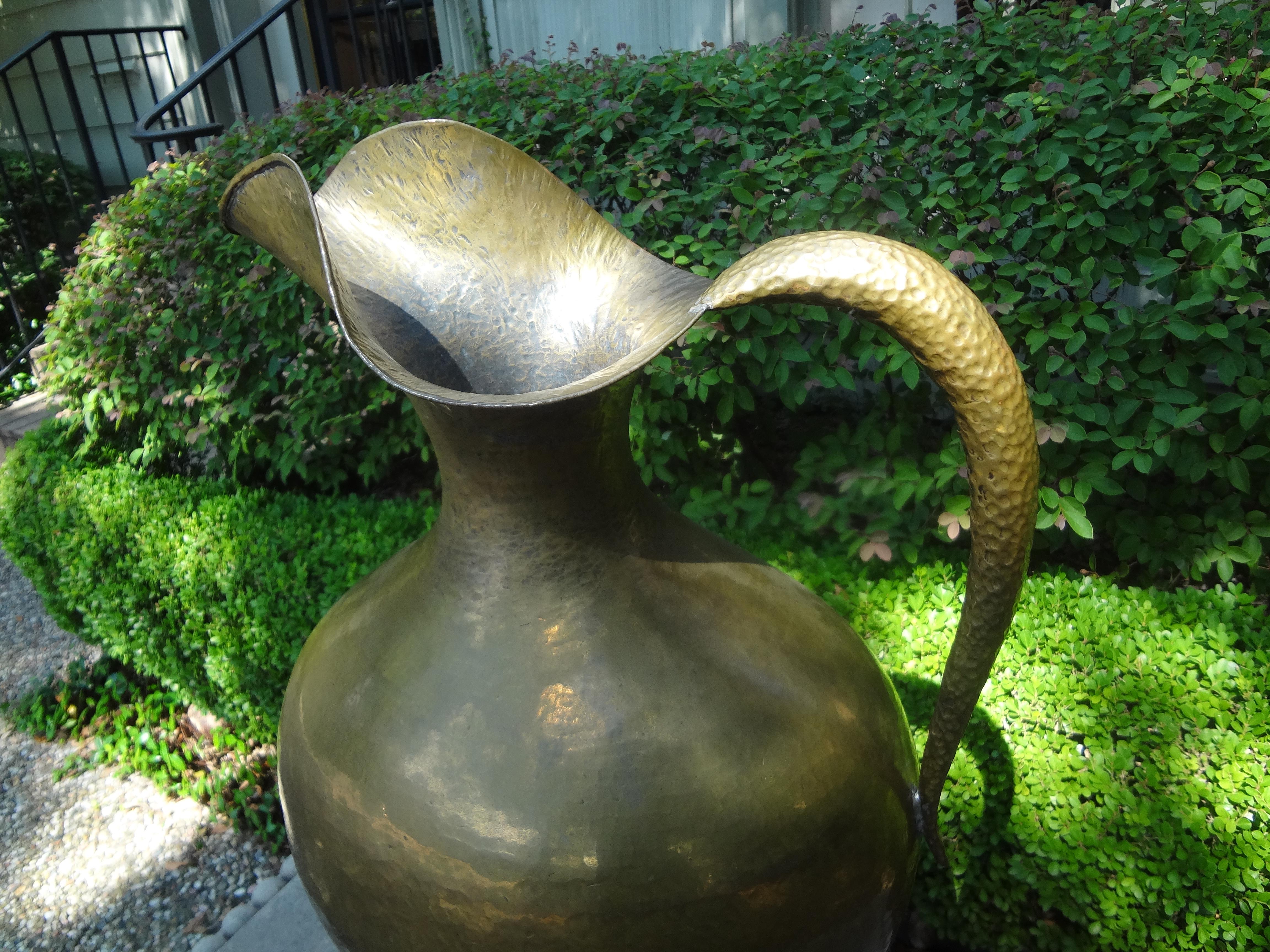 Monumental Italian modernist style hand-hammered ewer or brass pitcher stamped Egidio Casagrande, circa 1940.
This sculptural piece has a beautiful naturally occurring soft patina and is stamped with makers mark on the bottom.
A second almost